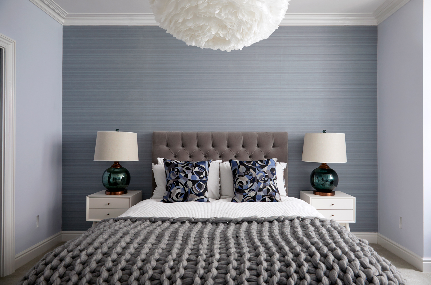 Cool and calming colours with inviting soft textures in this basement guest suite 