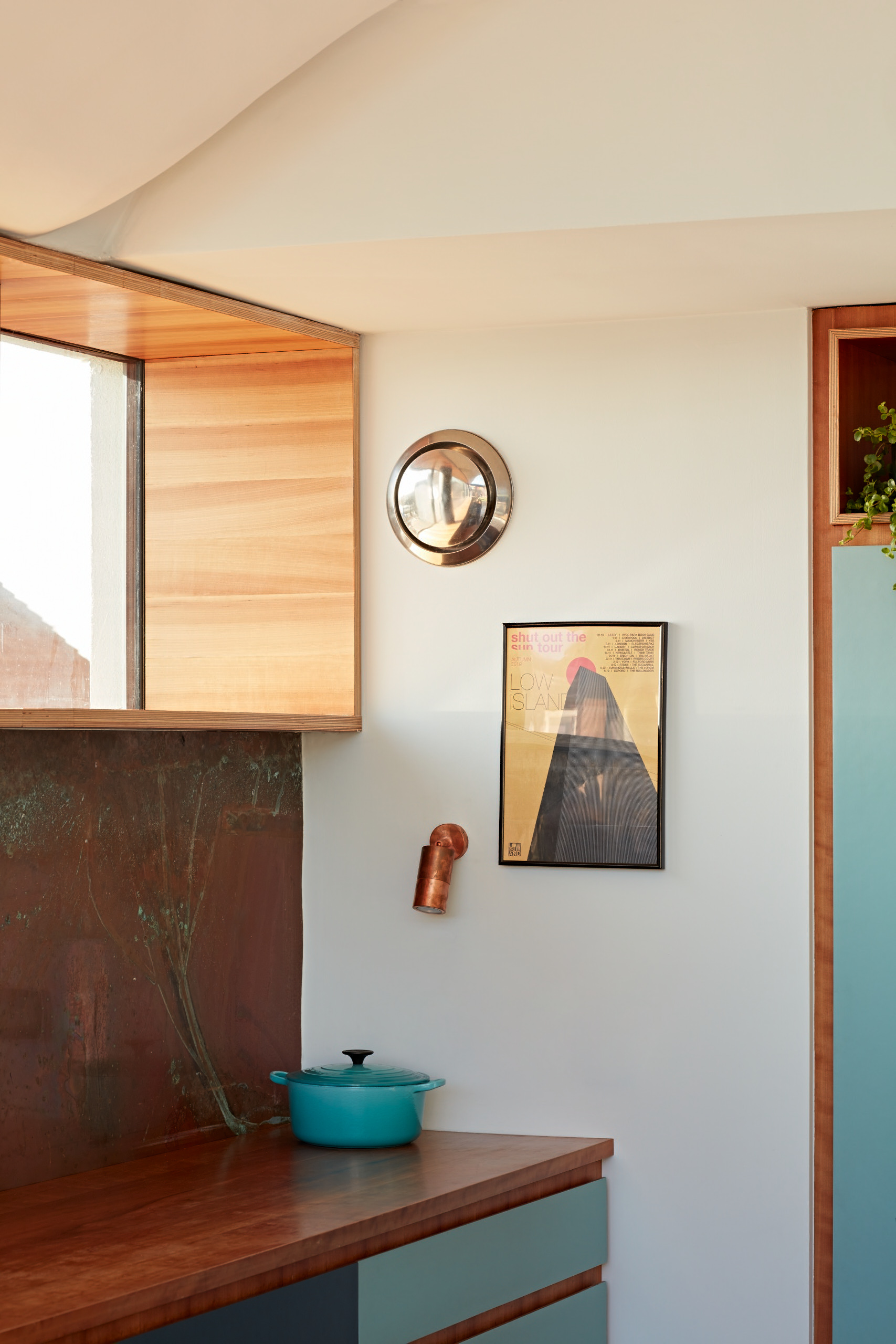 We designed cherry linings to all the windows to create a feature of the deep windowsills. The copper splash back had a bespoke patina achieved by experimental processes.