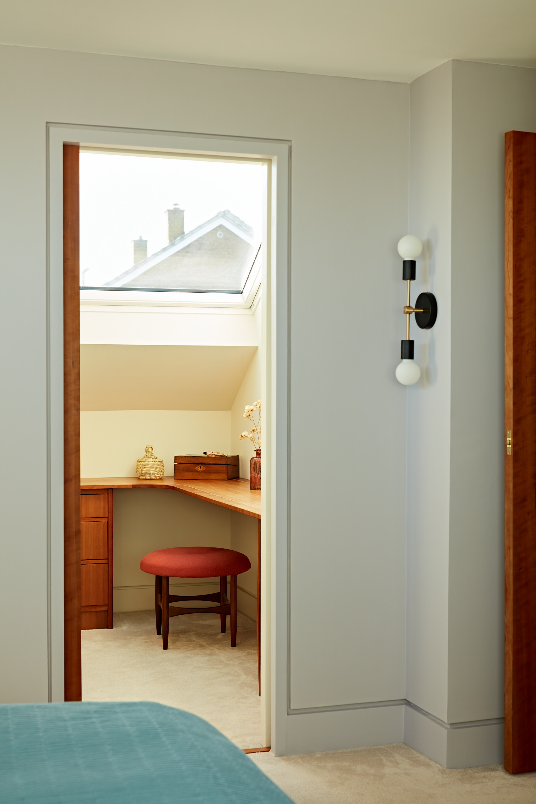 A concealed sliding pocket door with flush skirting and shadow gap architrave detail.