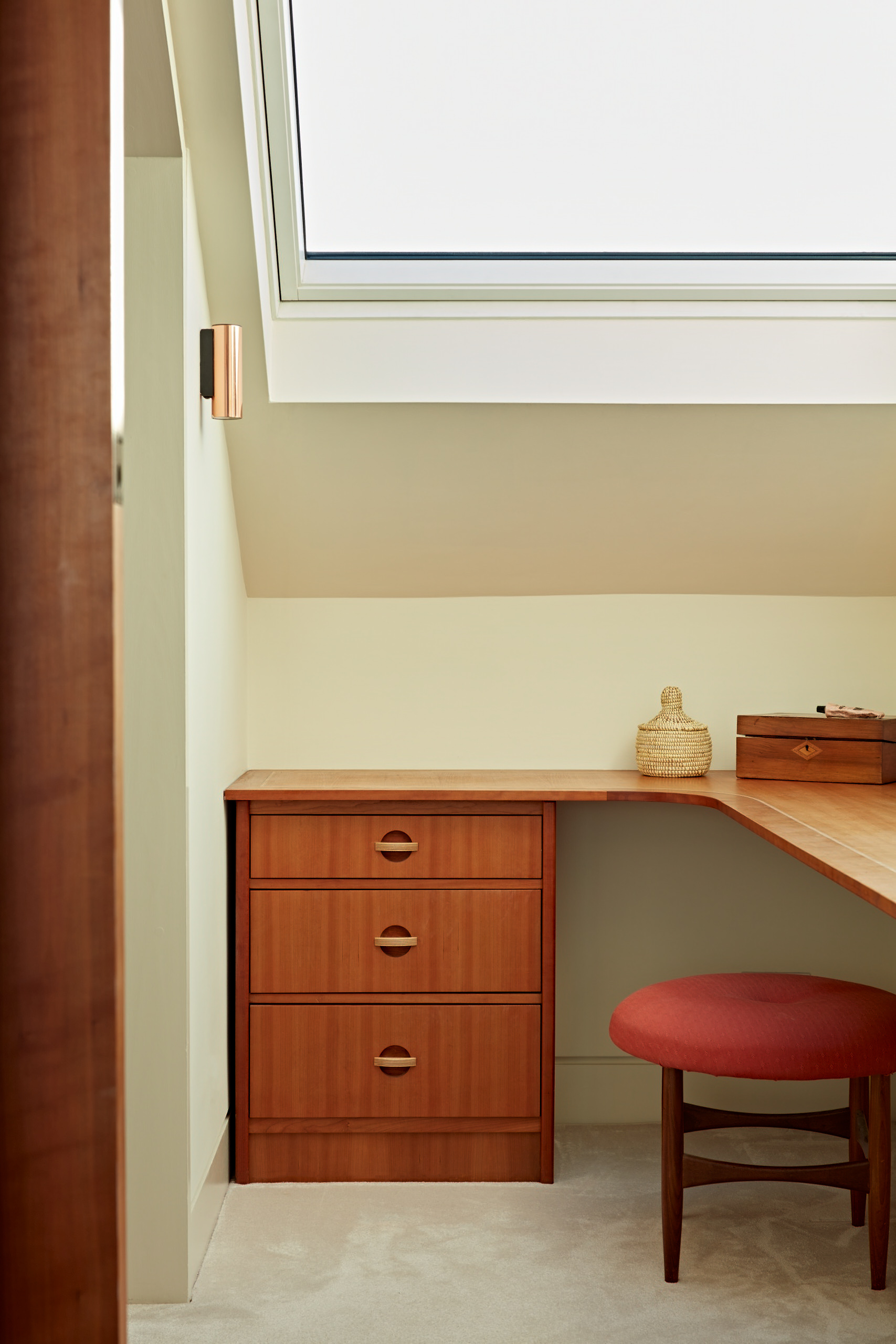 The private dressing room with skylight and a bespoke designed cherry dressing table.