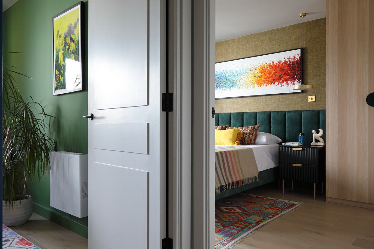 A view from the hallway into the study and bedroom