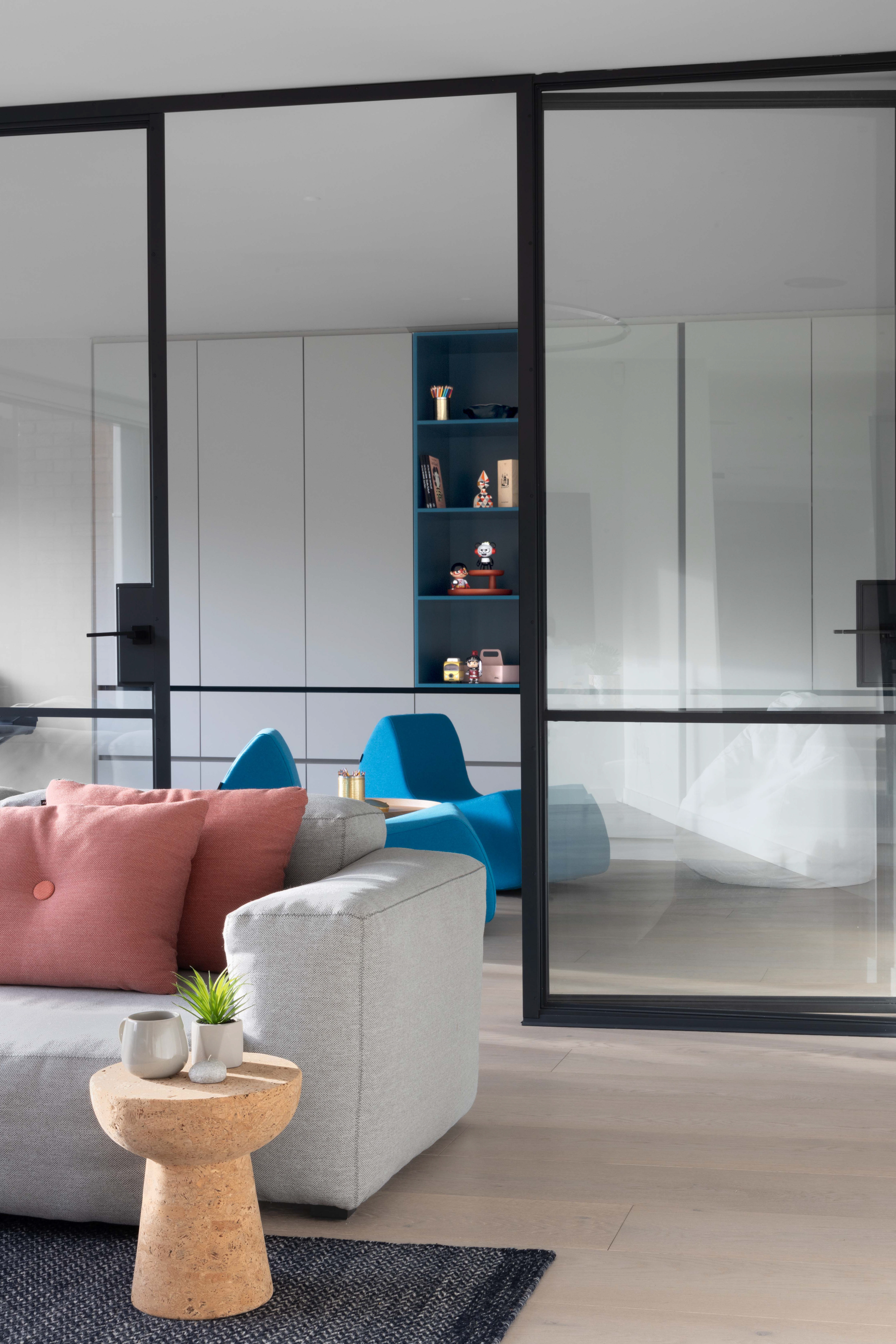 Playroom with bespoke joinery and glass door room dividers - all designed by H. Skogen Design