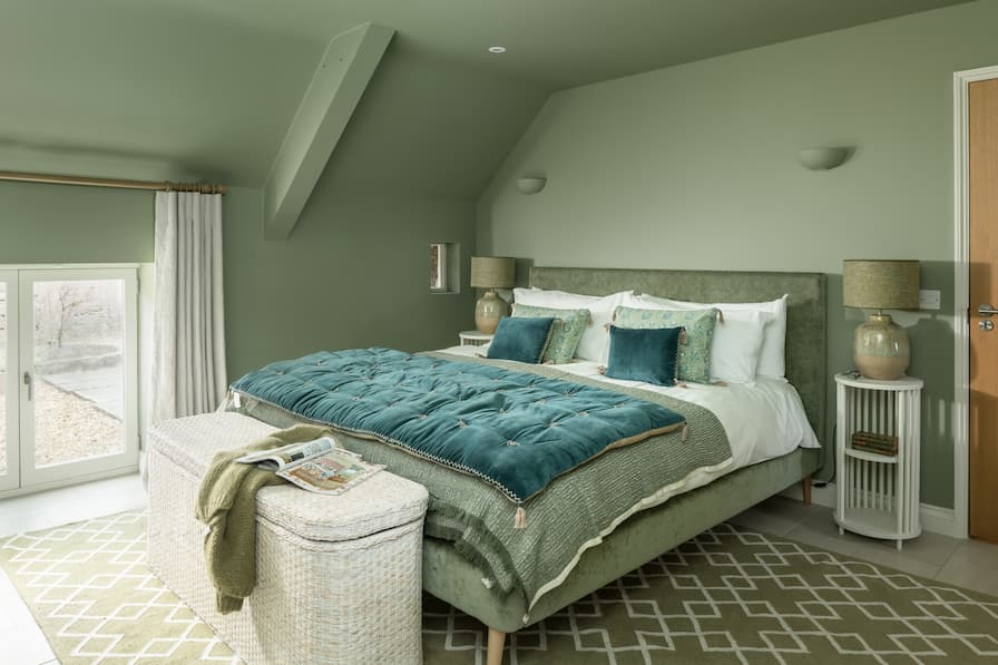 Green Guest Bedroom with Velvet Futon and Scatter Cushions