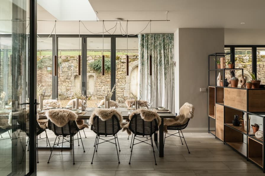 Long dining table styled with dried flowers