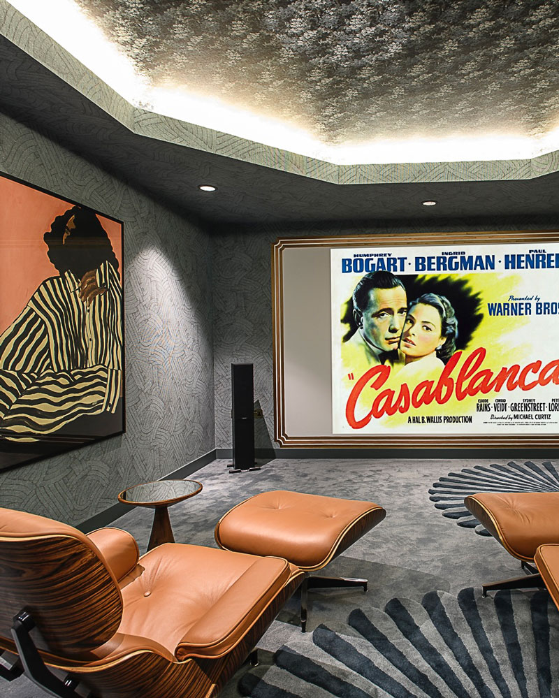 Cinema room with textured wallpaper and film showing