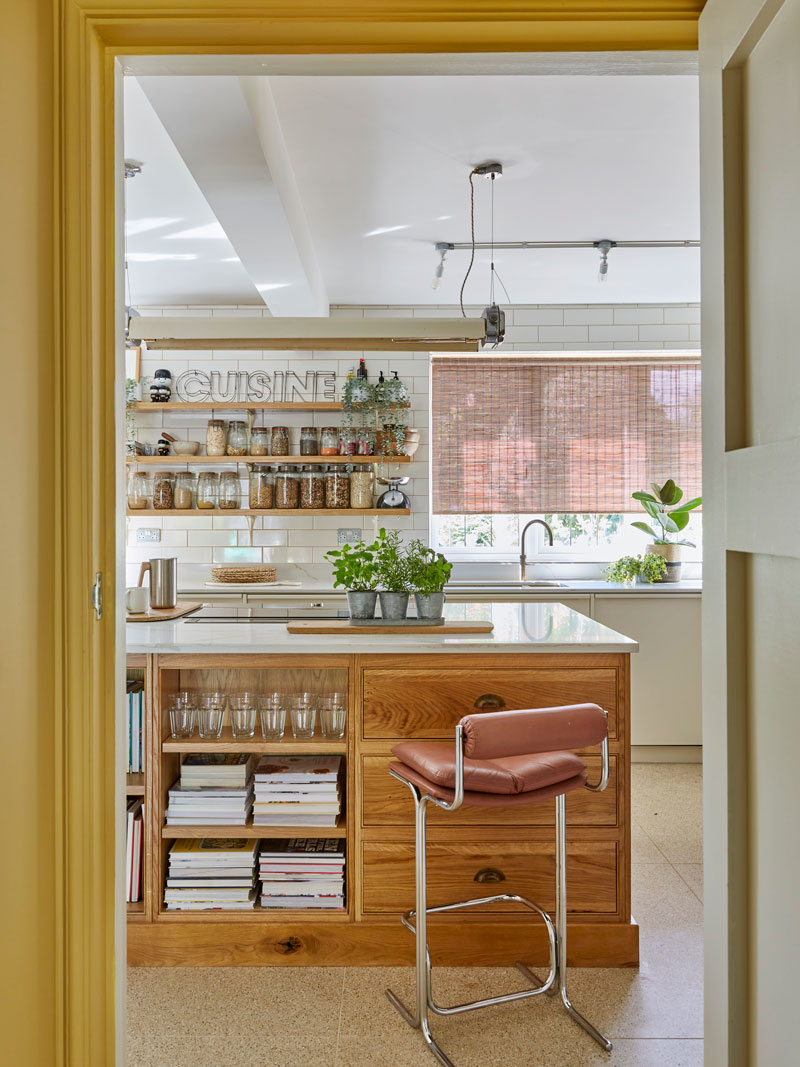 Bespoke Kitchen with oak Island unit and shelves behind