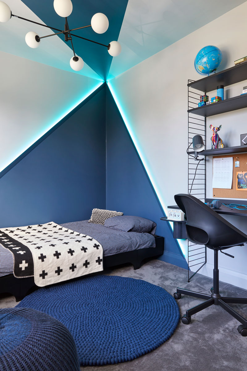 Teen Boy's Bedroom with abstract light diffused painted mural, string shelving desk