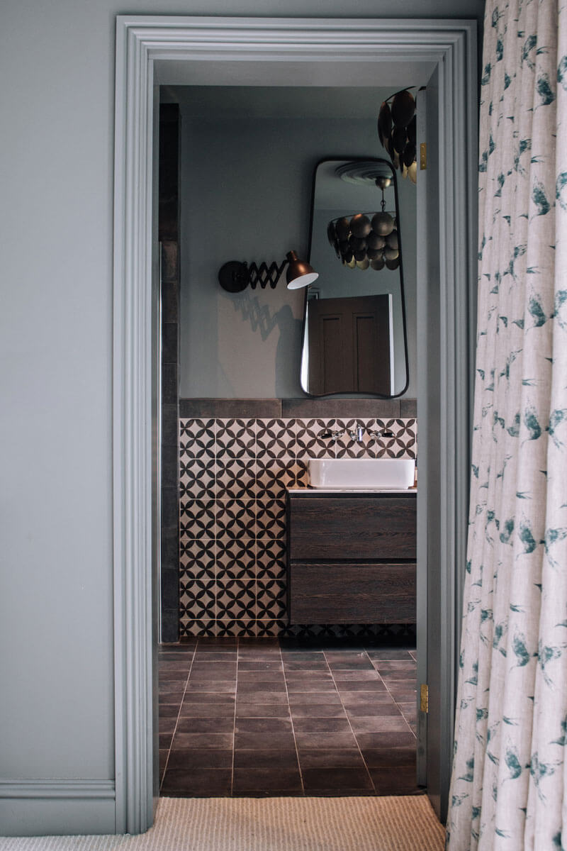 Master Ensuite view from bedroom with vanity unit and pattern tiles