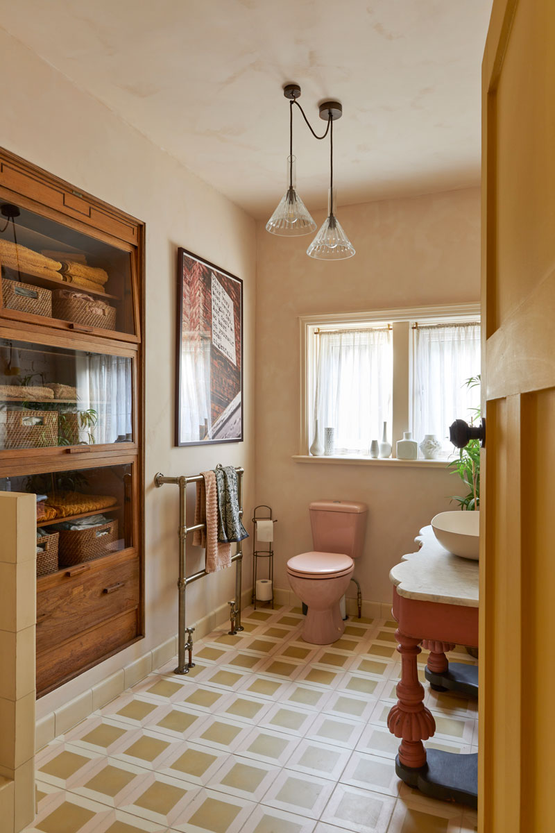 Cloakroom with vintage unit and pink loo!