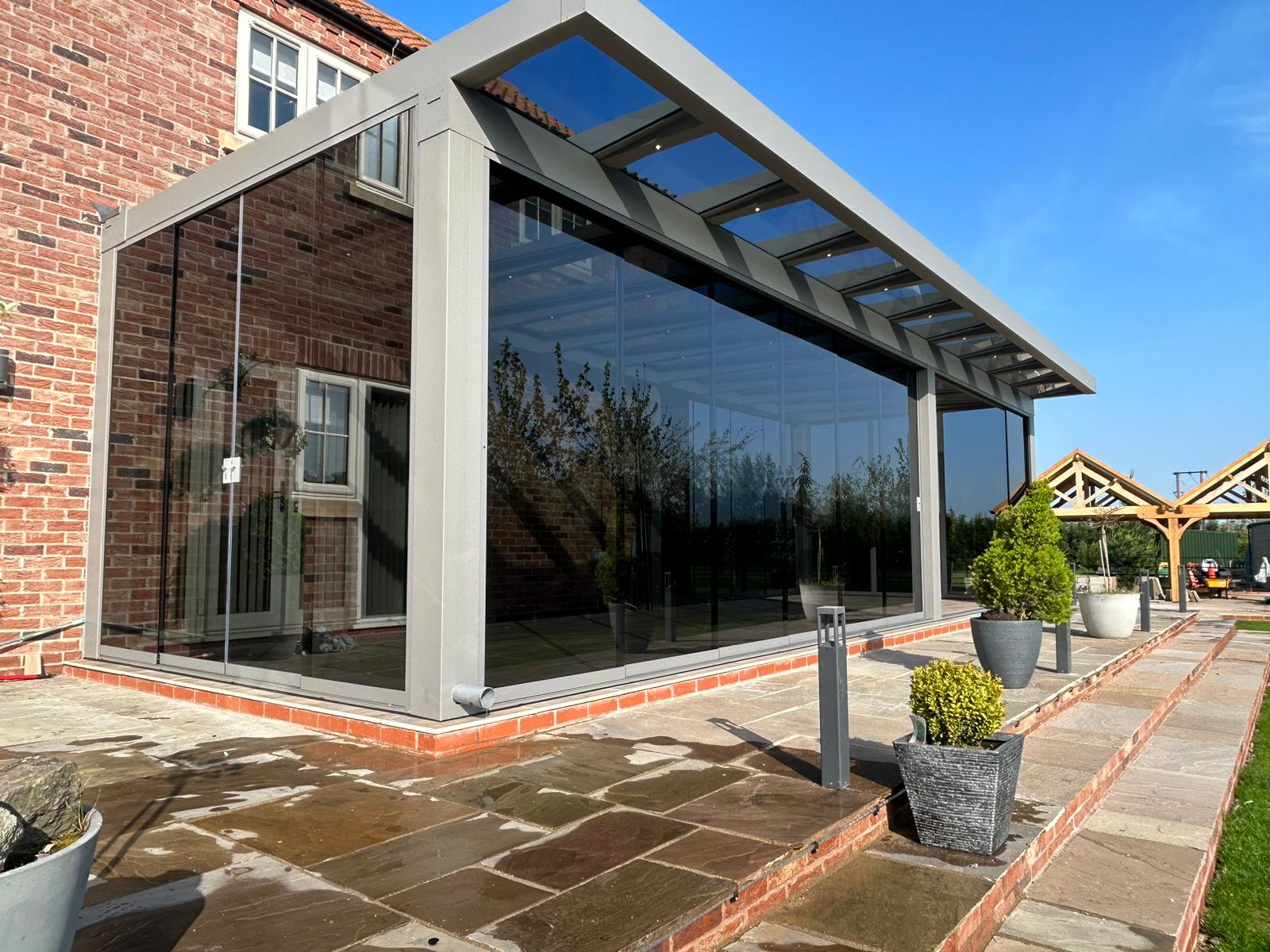 Mid-grey glass room with grey anti sun glass for sliding doors 