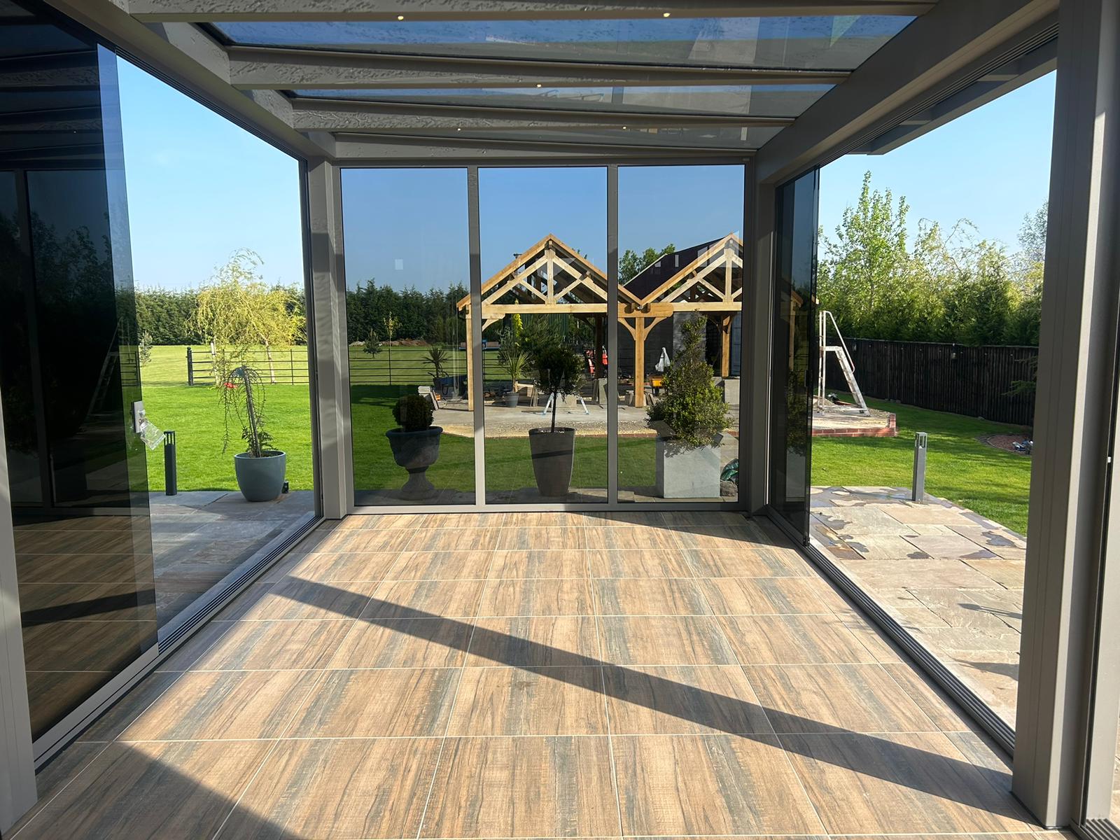 Mid-grey glass room with grey anti sun glass for sliding doors 