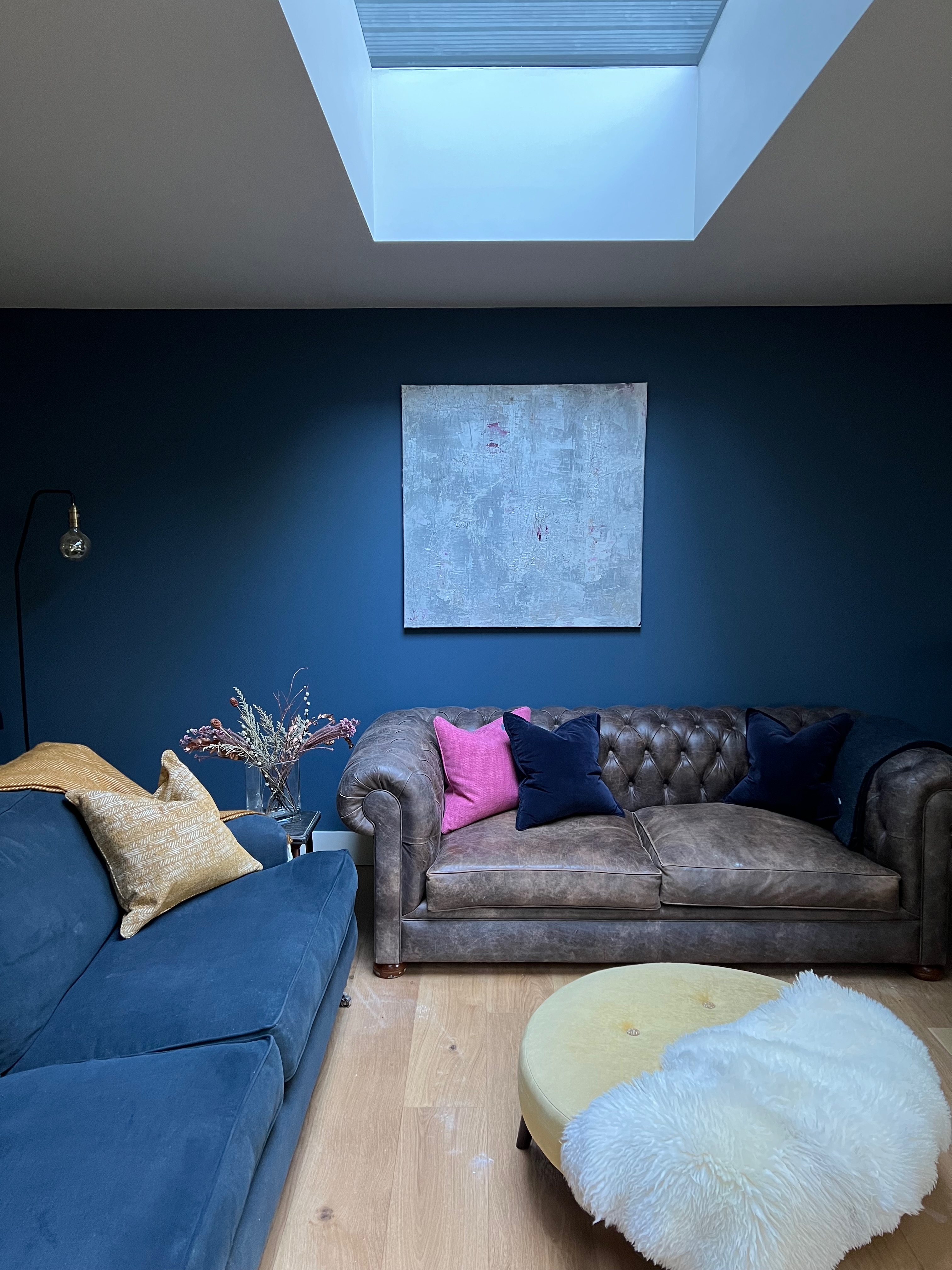 Living room with skylights above