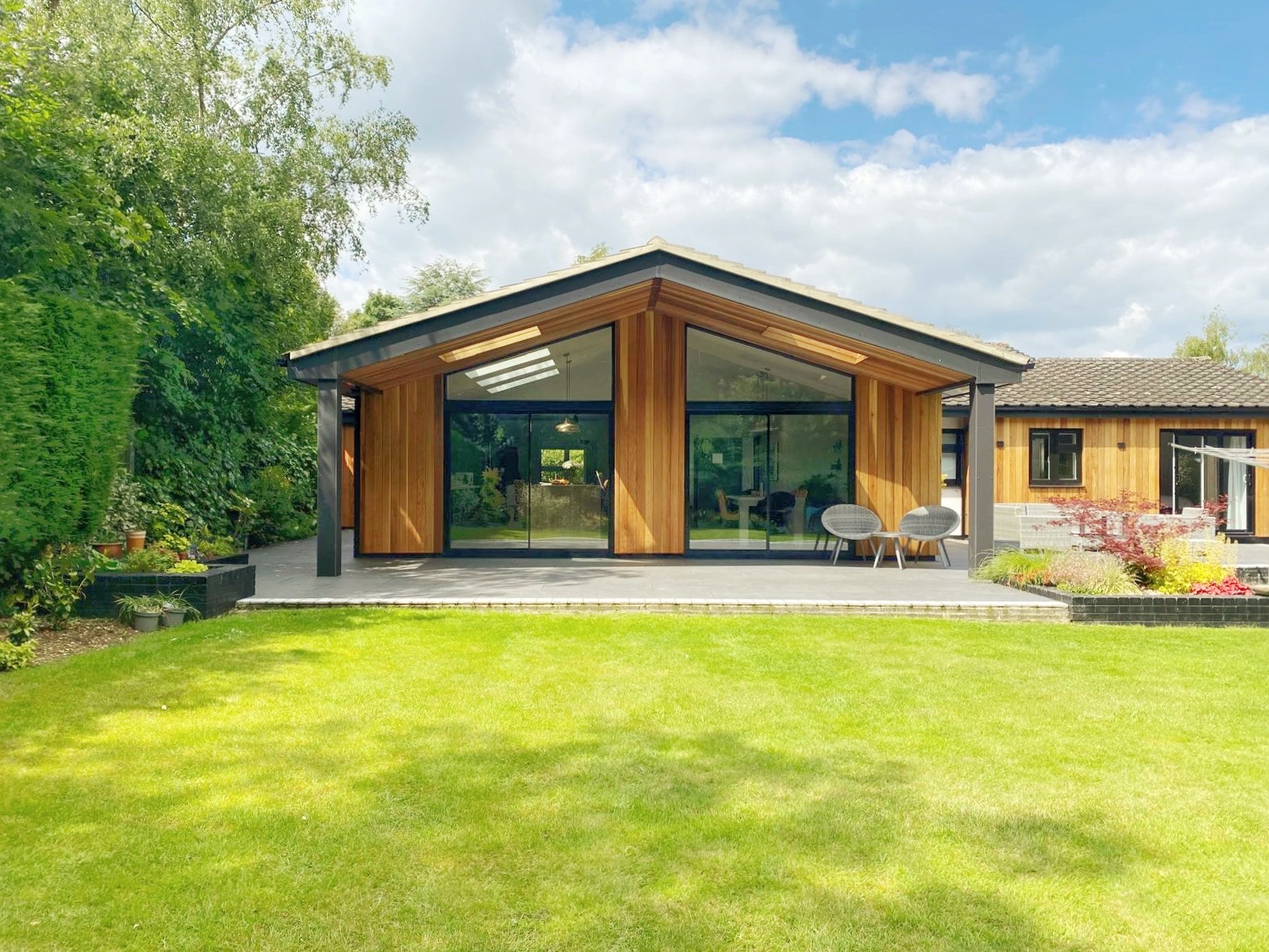 Rear gable of the house with enlarged glazing looking out to the garden from the kitchen