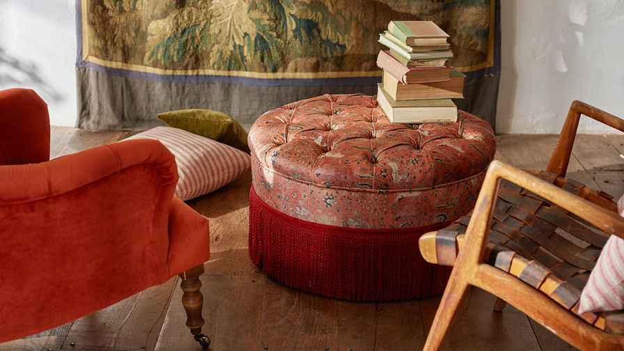 Burford Buttoned Footstool in V&A Threads of India Opulent Velvets Lahore Dynasty Flame with fringe in Sophie Bullion Fringe Currant