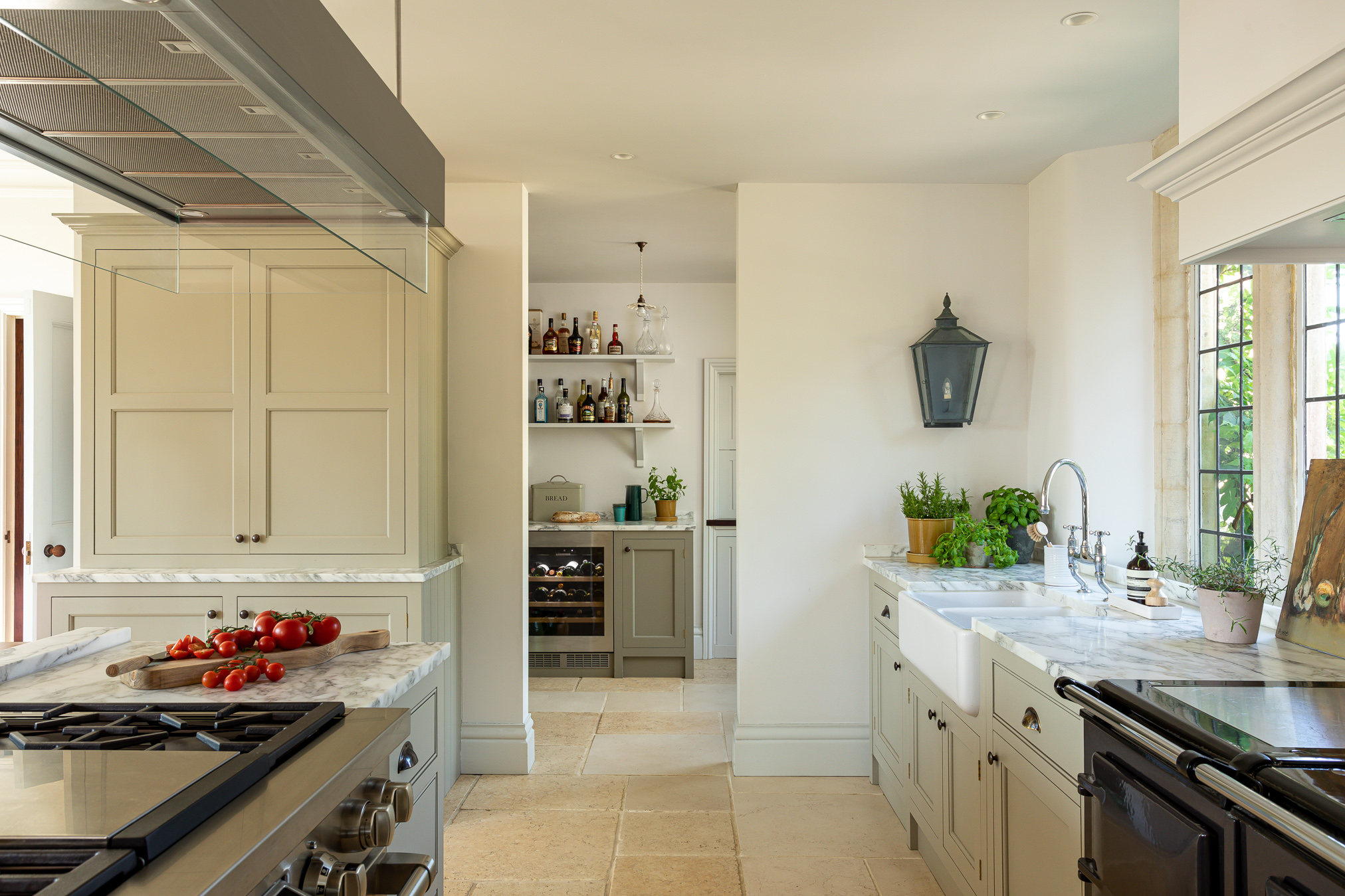 Painted shaker kitchen limestone floor back kitchen pantry butlers kitchen