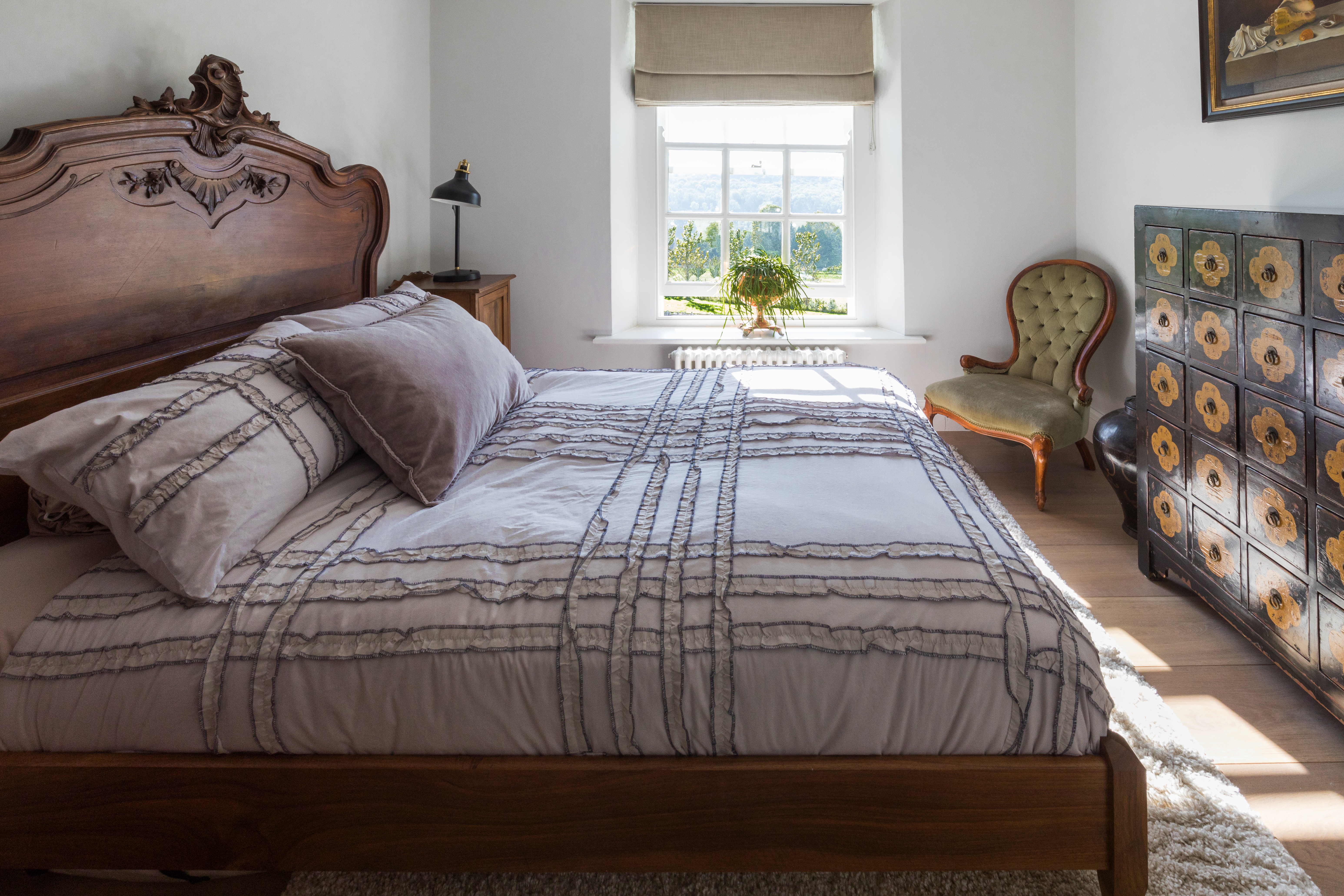 Guest bedroom antique headboard and medicine chest