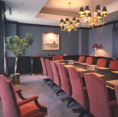 Rosewood table with suede covering on chairs