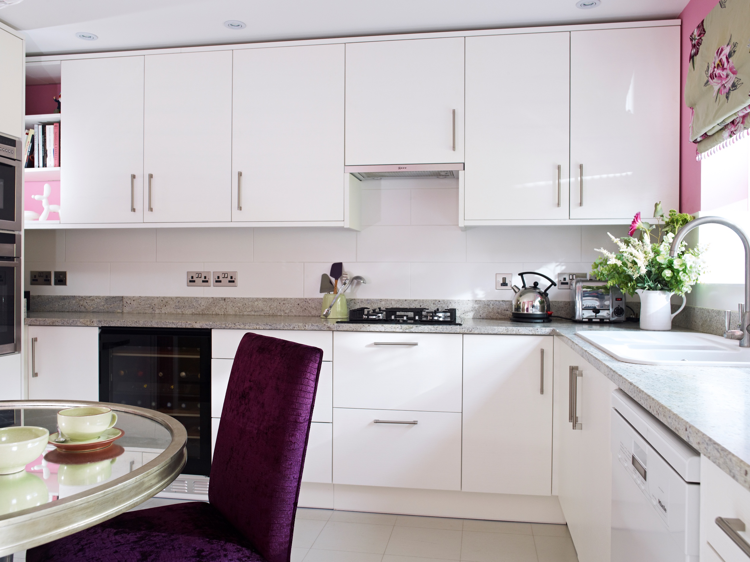 Previously a typical 1980’s wooden “traditional” kitchen, completely gutted and recreated to maximise storage and visually open the space