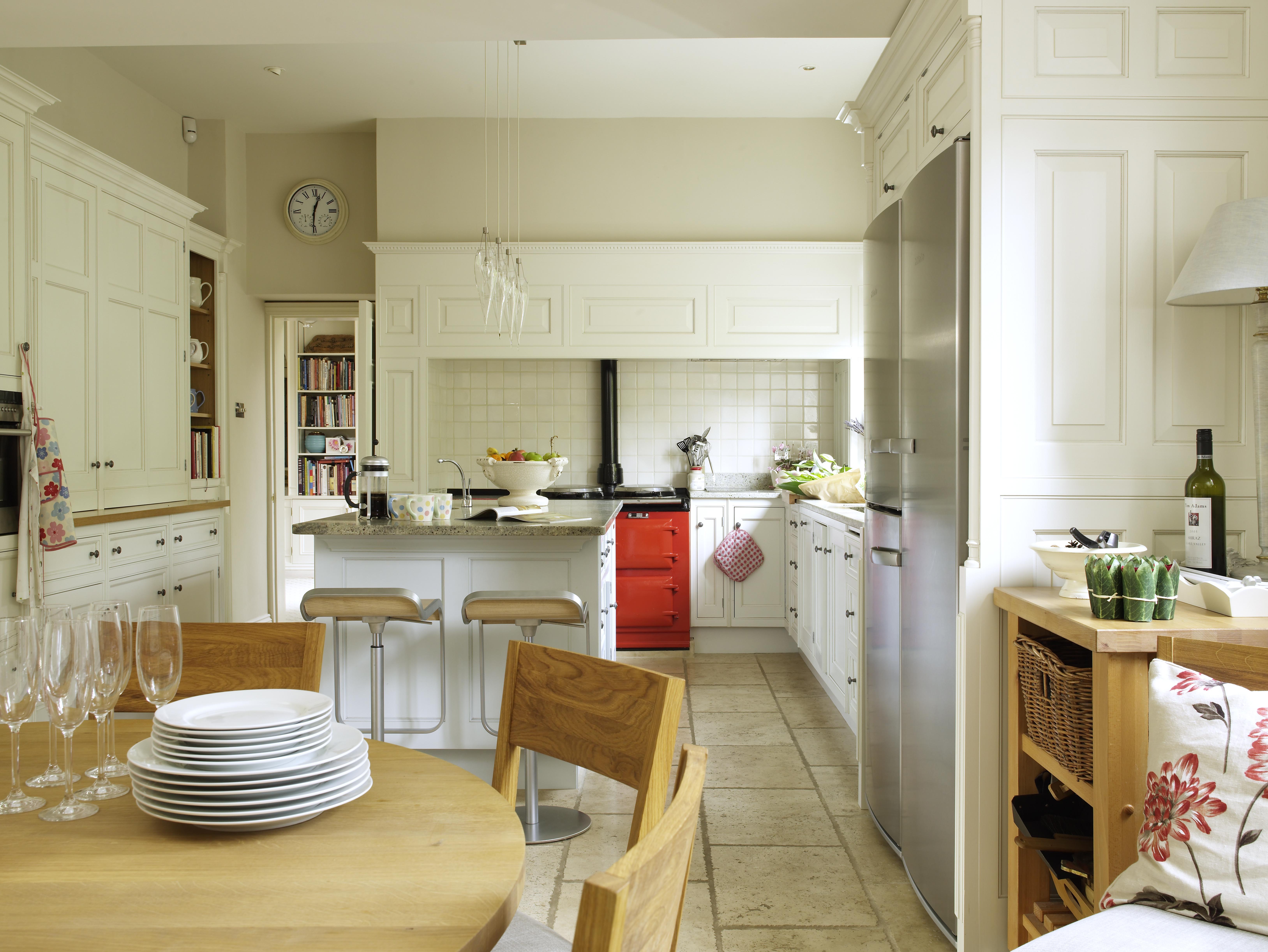 we opened up the kitchen to create an informal dining space, clever planning allows multi-use in the kitchen area and hides appliances