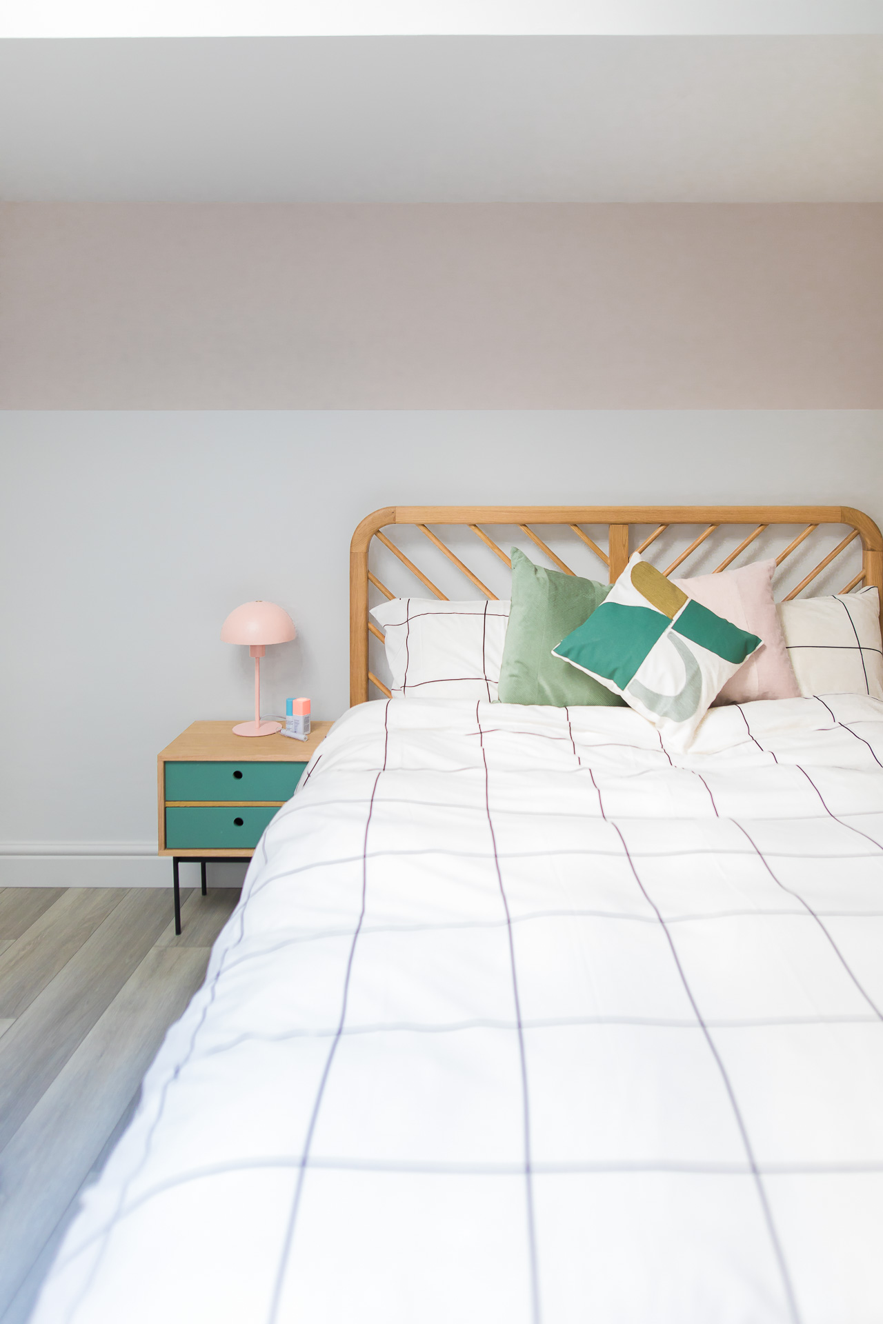 guest bed with pink wall shape