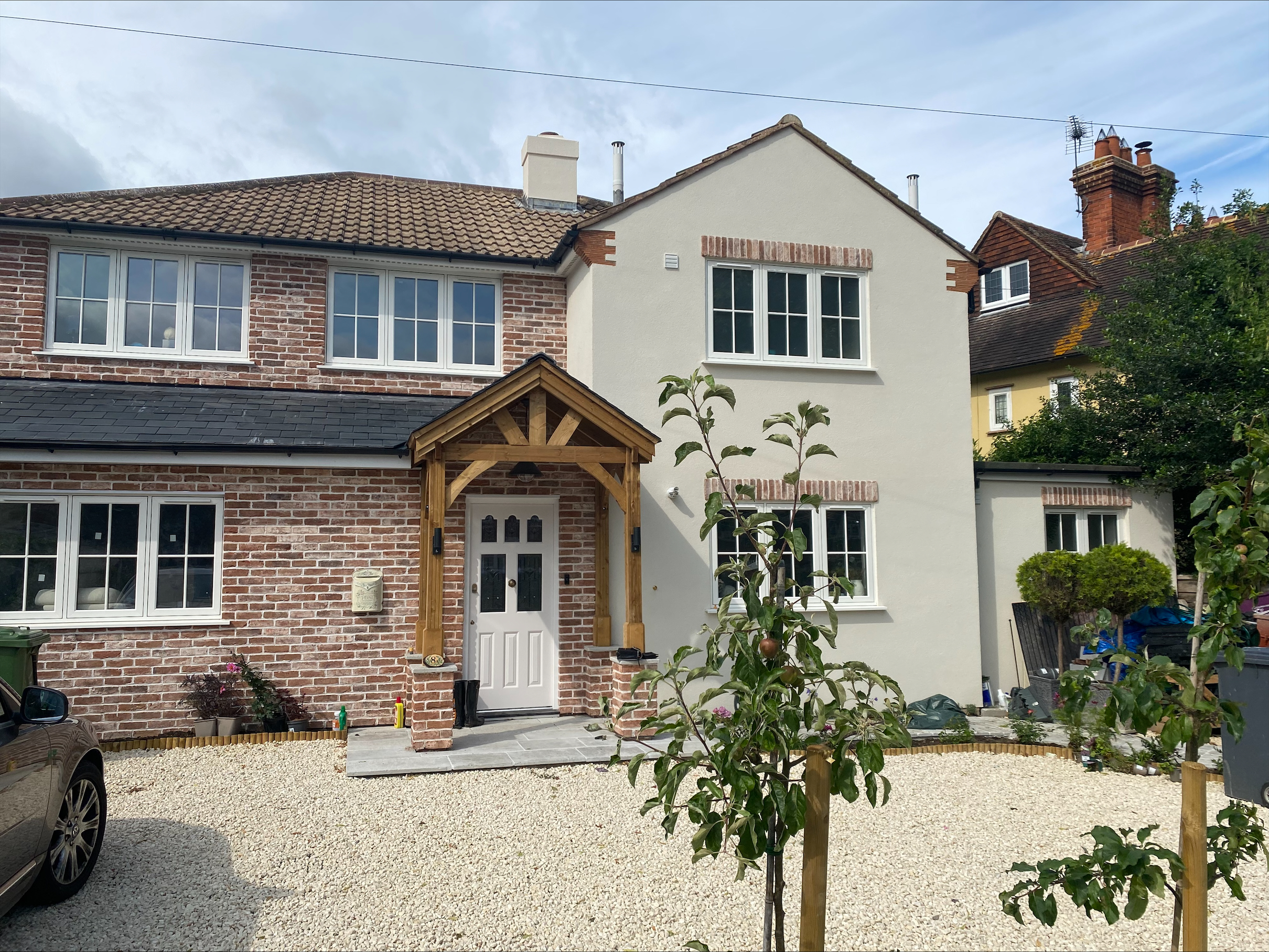 A home clad with red reclaimed style brick slips