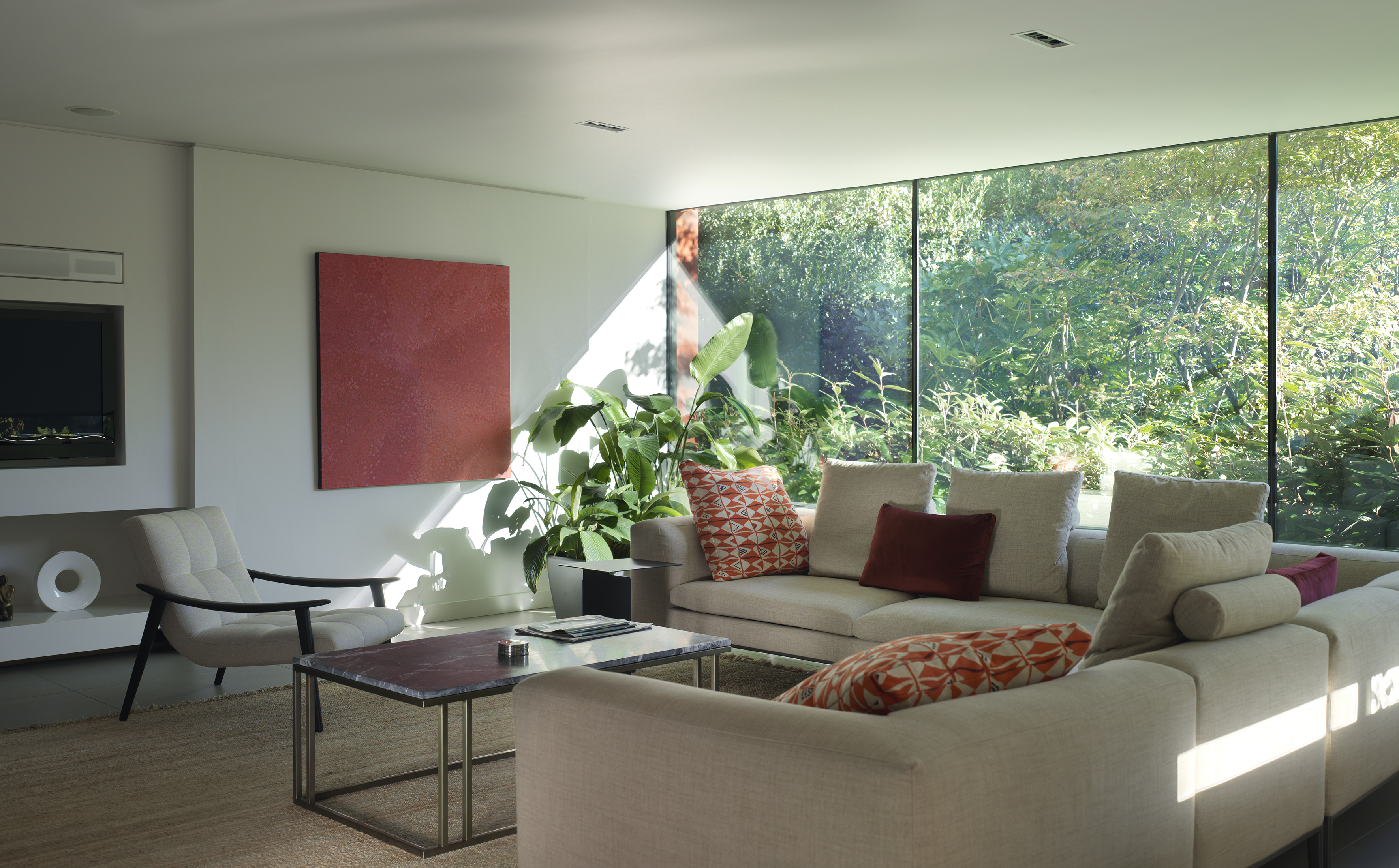 Open plan lounge area, soft white, pop of colour, greenery