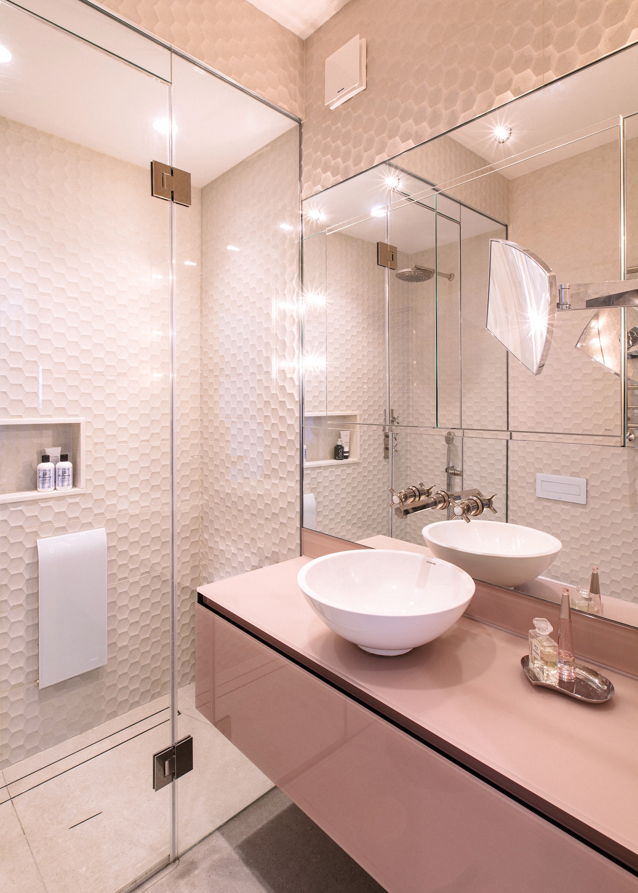 Steam room, pink and taupe, ceramic tiles and glass vanity unit. Nickel and mother of pearl brassware