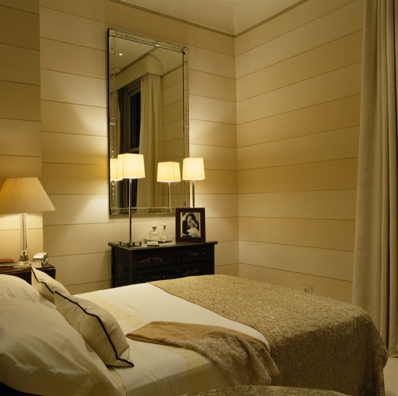 Horizontal stripes which is a signature of CFD, 18th Century French mirror with a pair of modern table lamps on a Chinese chest of drawers.