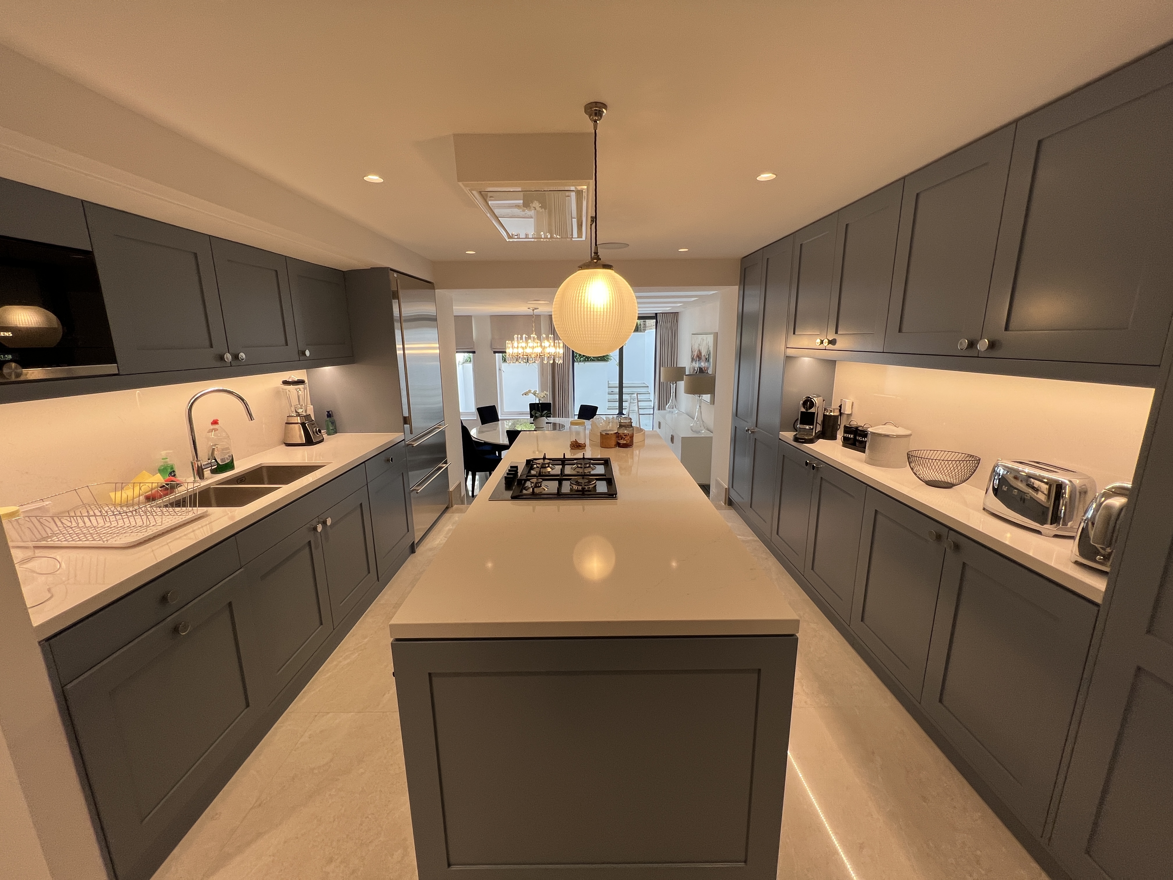 Kitchen area, with Crestron Home control.