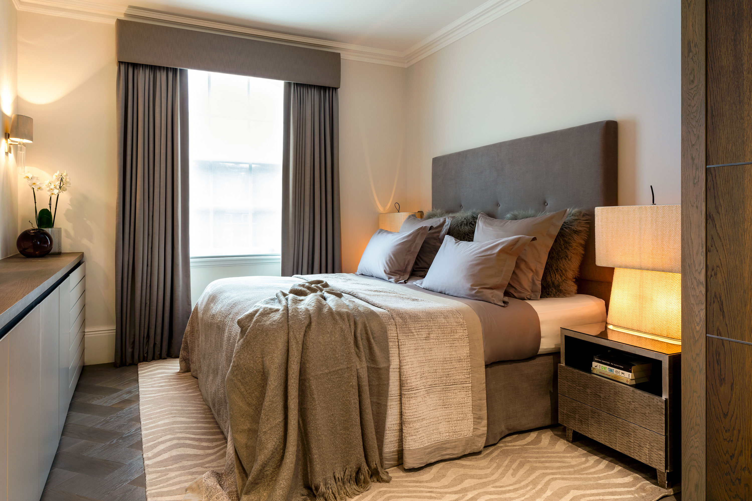 Classic, calm bedroom in textured taupe and cream