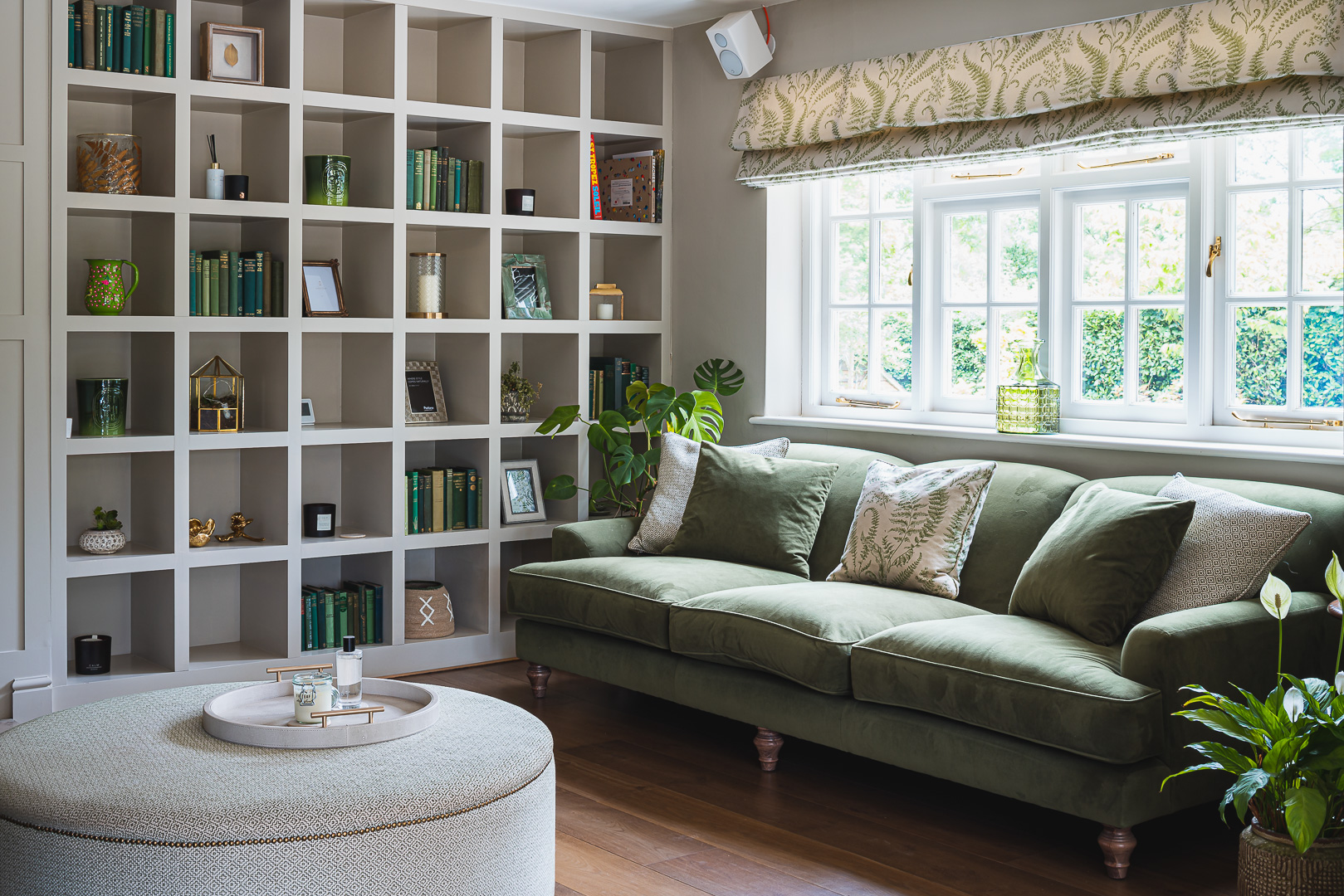 Family TV room in country style using dark green and cream colours.cream 