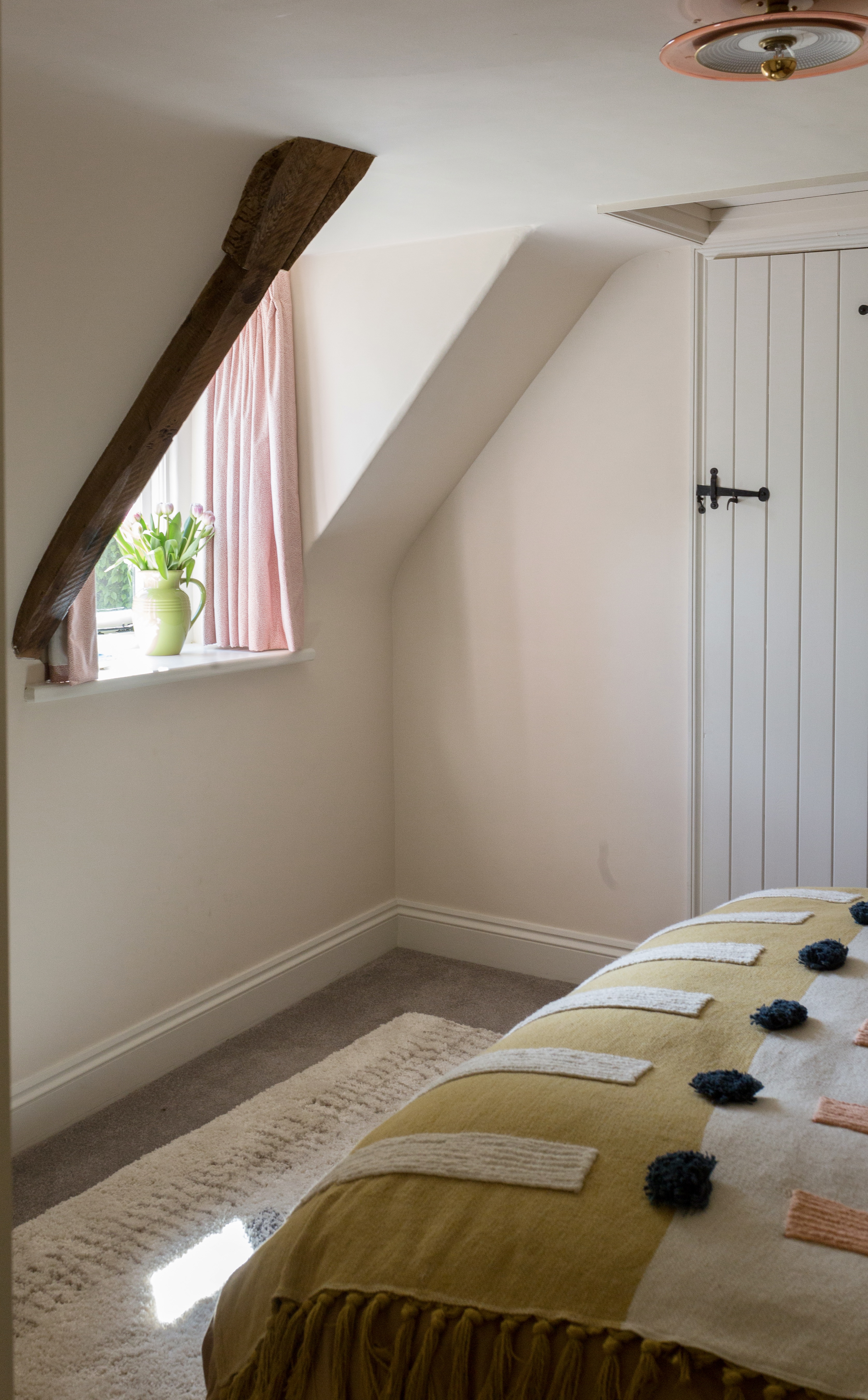 colourful guest bedroom dormer window