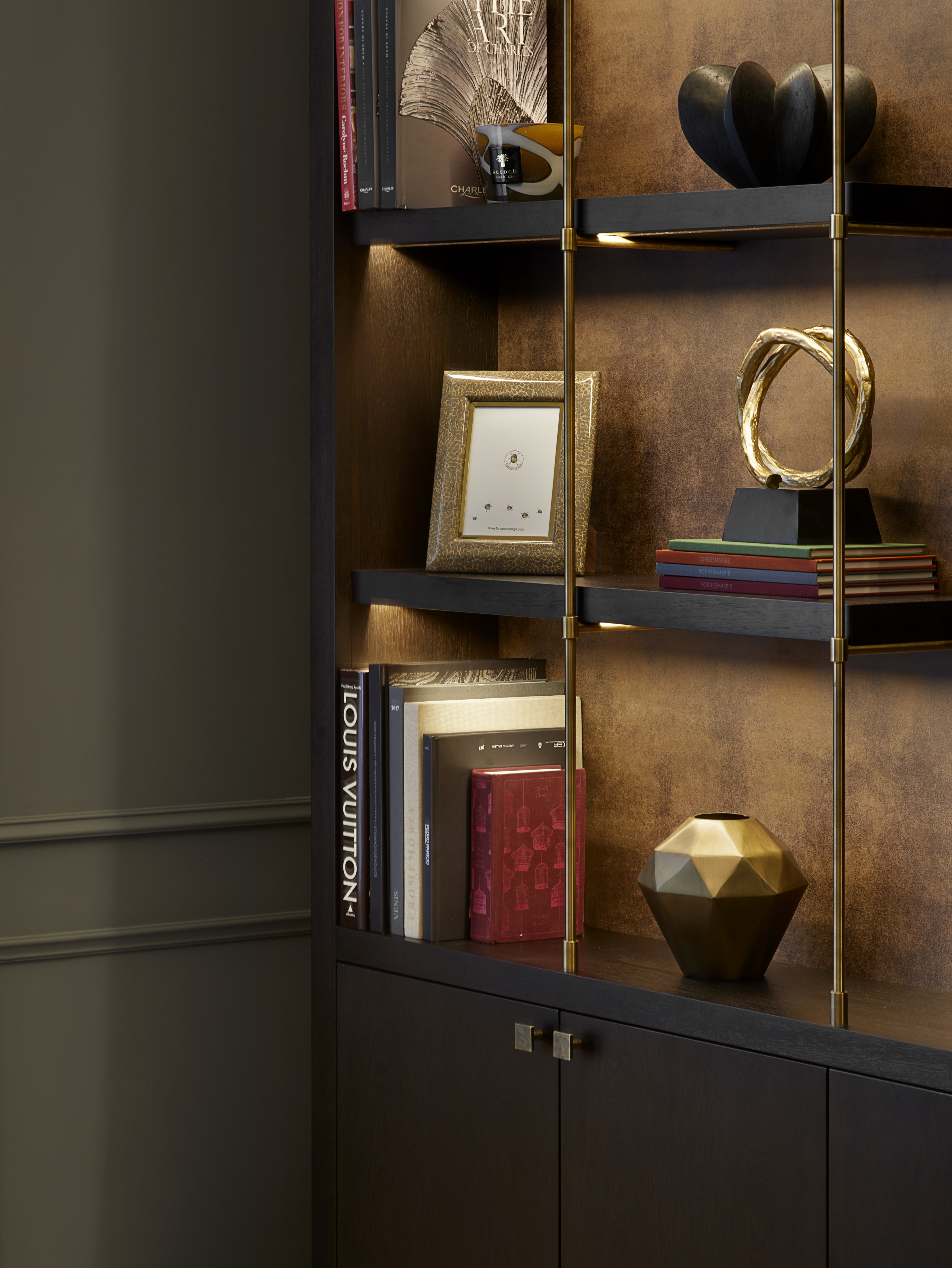 Shelving unit with bespoke metalwork and dark stained timber