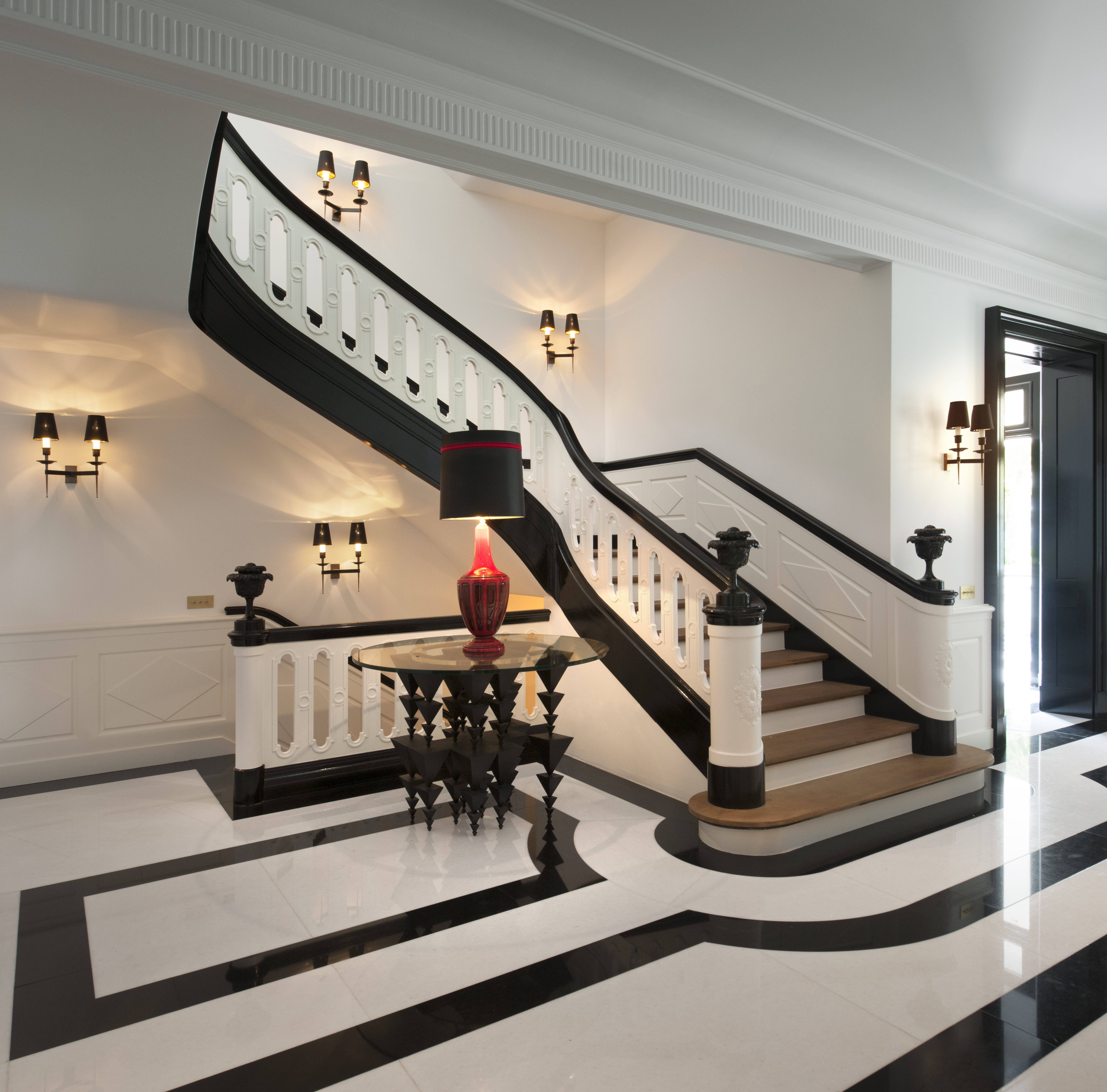 marble hallway acts as the central spine of the villa