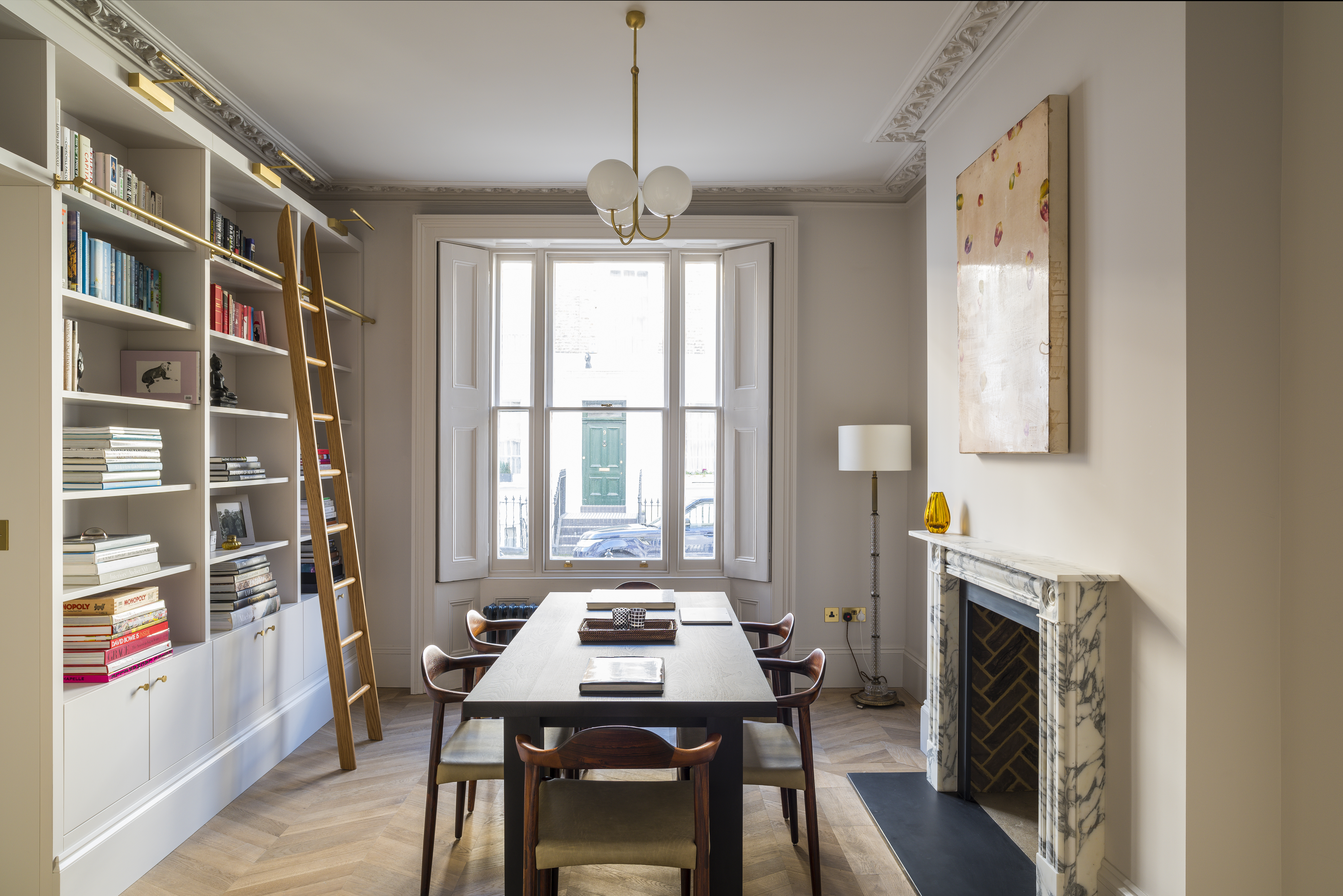 Beautiful dining room with a bespoke hand painted library