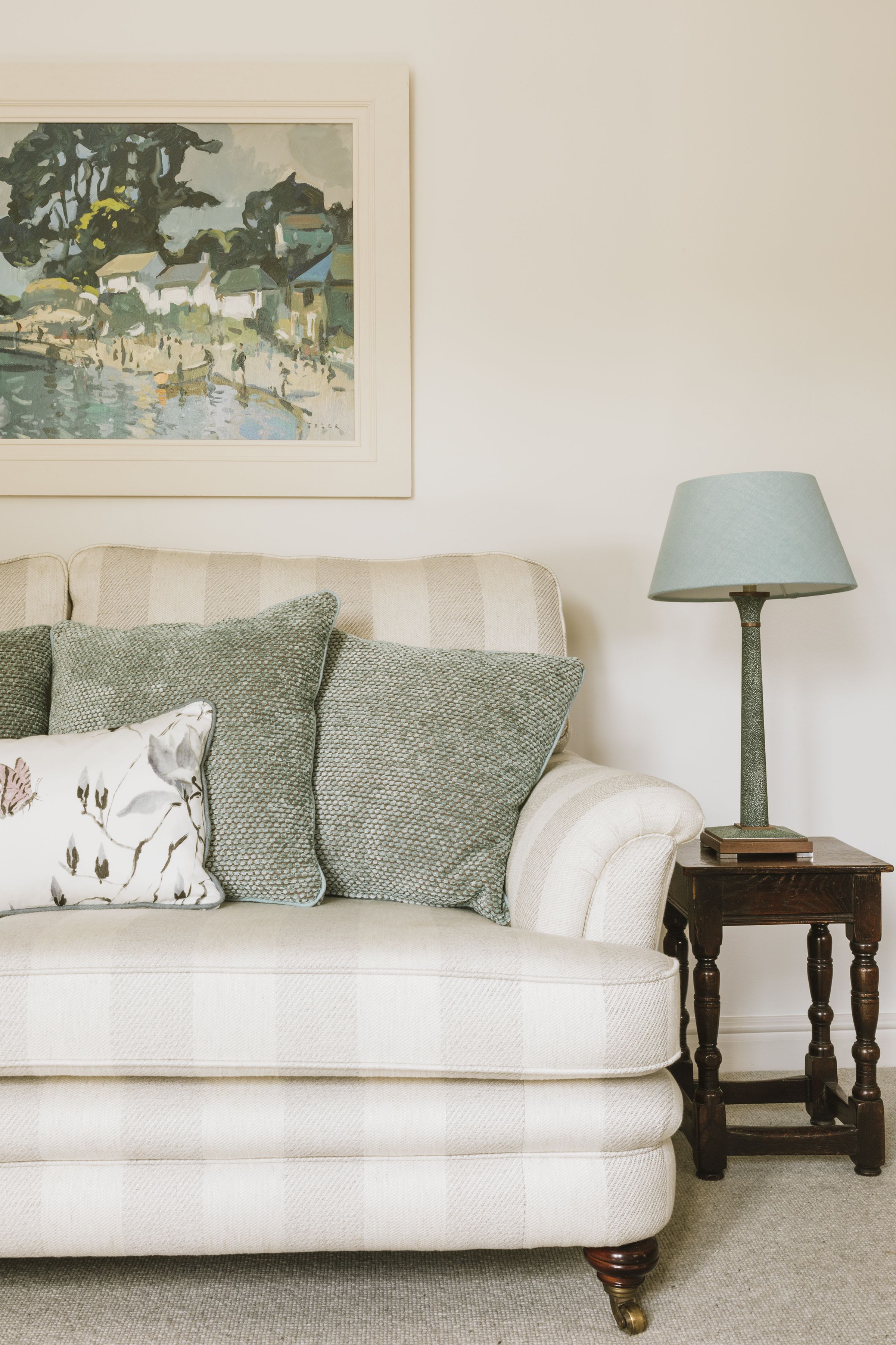 Traditional sofa reupholstered in Osborne & Little wide stripe fabric. Bespoke linen lampshade