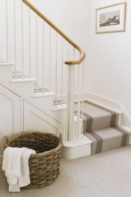 New cottage staircase in simple Shaker style with oak handrail and Roger Oates runner