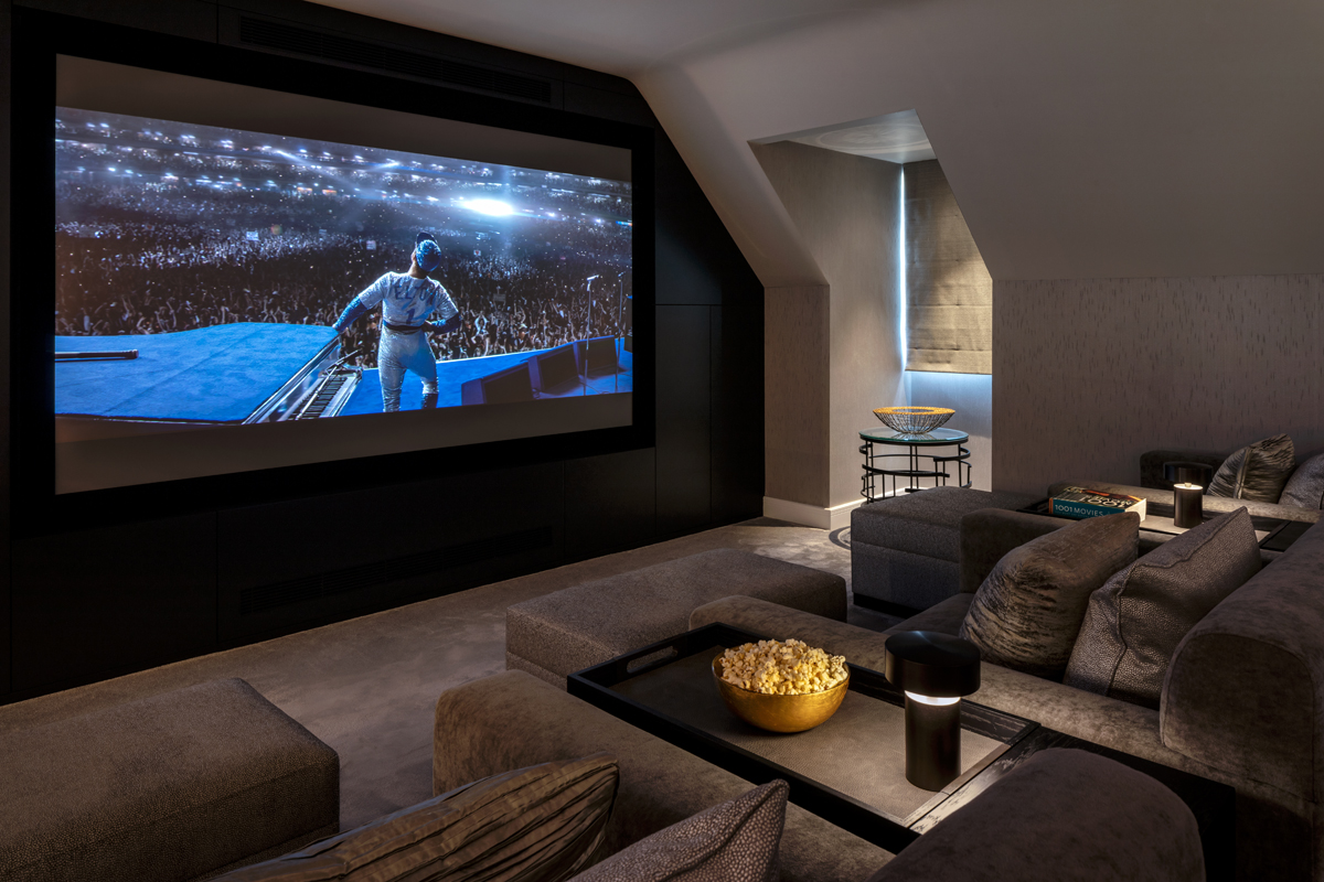 Elton John on the TV screen in a luxury home cinema room. 