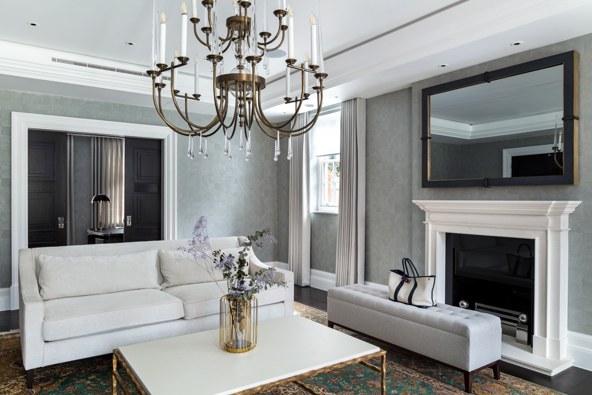 Living room with mirror, chandelier and luxury seating