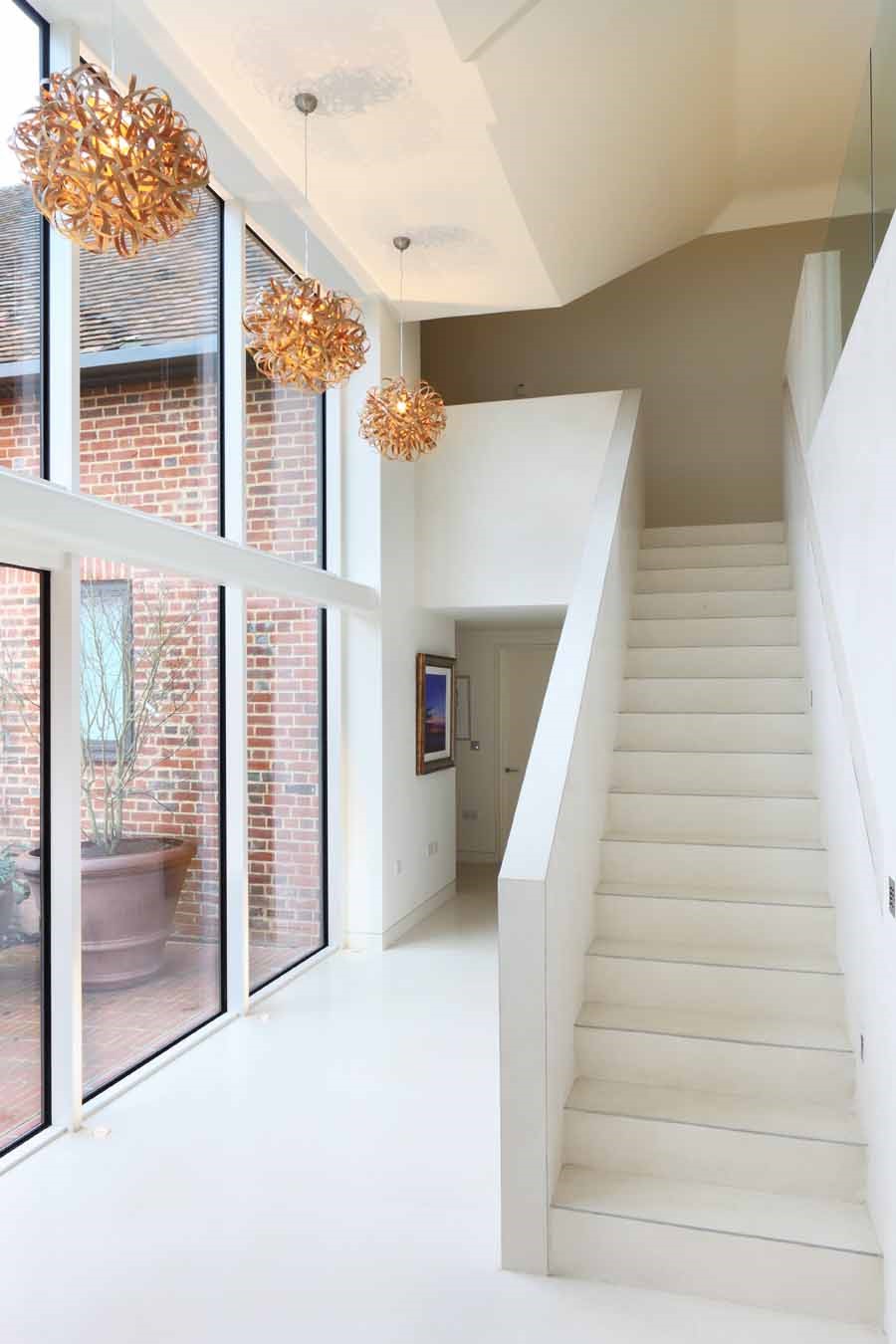 Entrance hall; concrete stairs; tom raffled lights