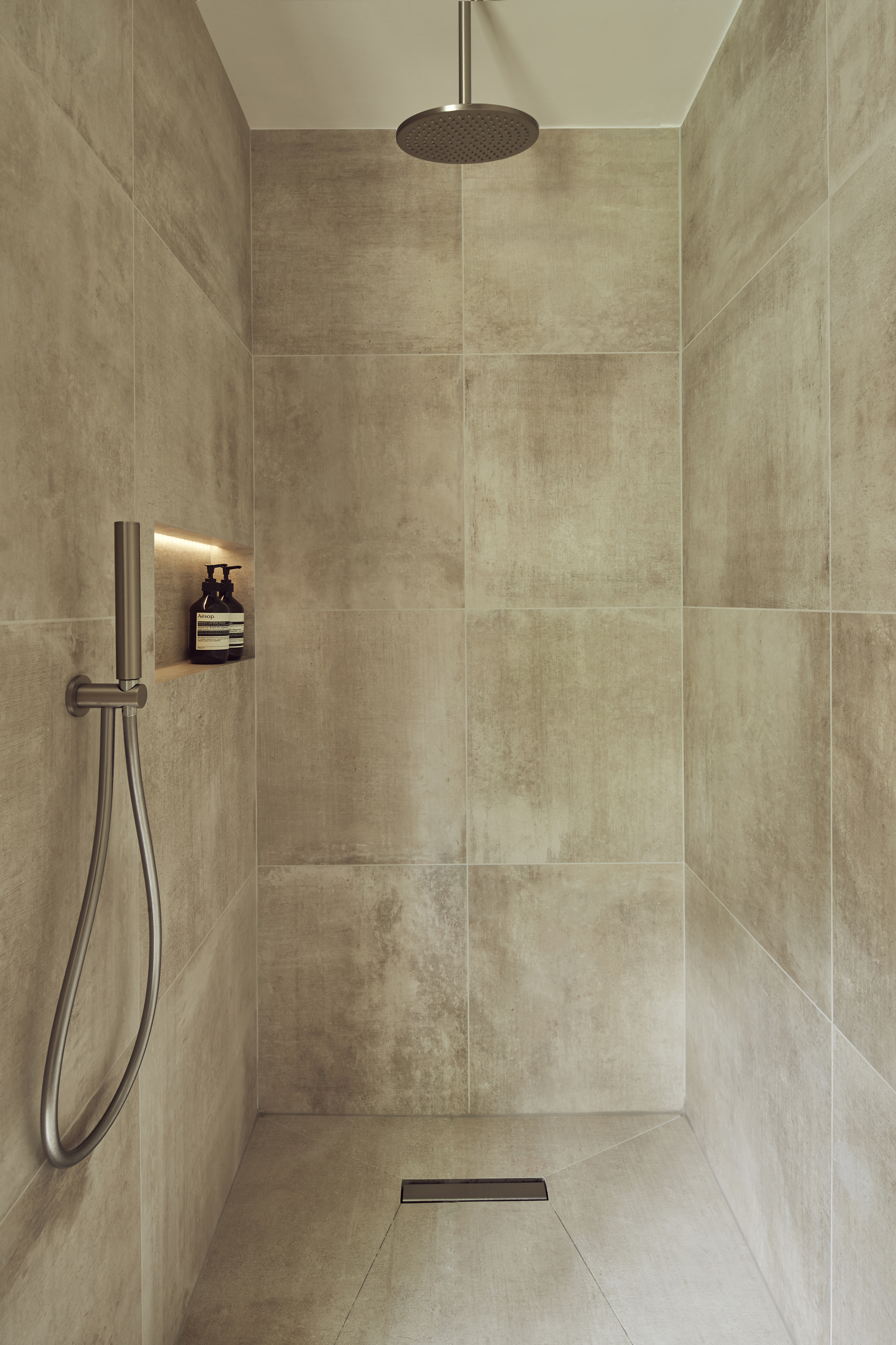 contemporary bathroom with lit shower niche