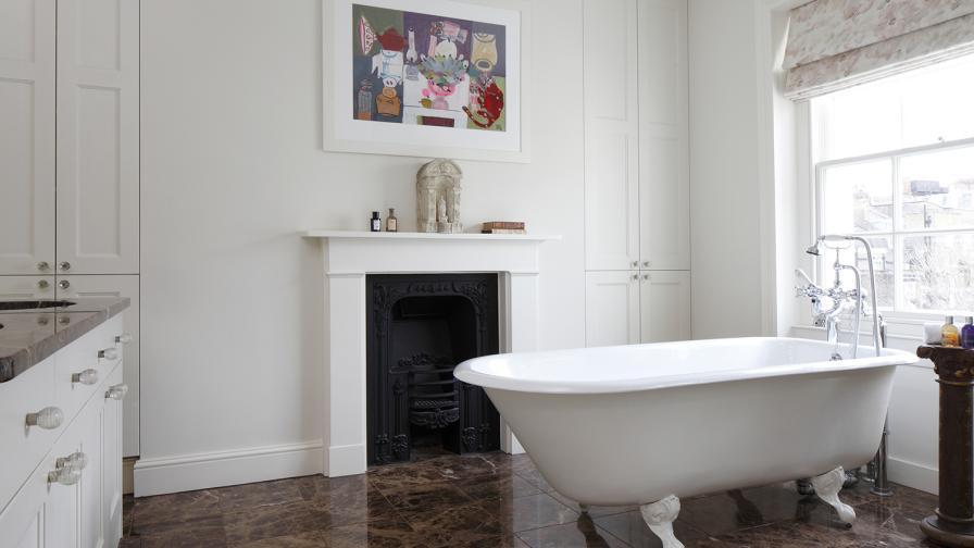 The ensuite bathroom with underfloor heating below a rich chocolate brown/nero marble tiled floor.