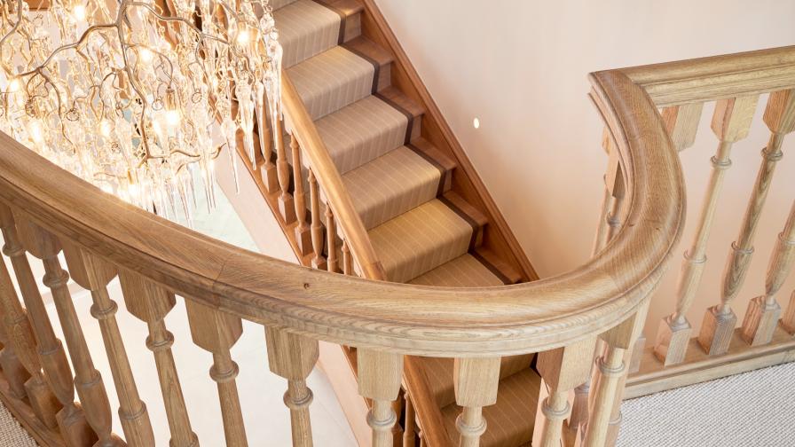 Detail view of the handrail and balustrade from an oak elliptical staircase