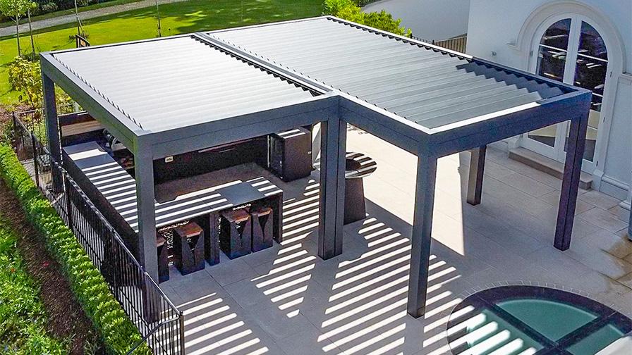 Double Louvre Pod pergola in grey with an outdoor kitchen installed