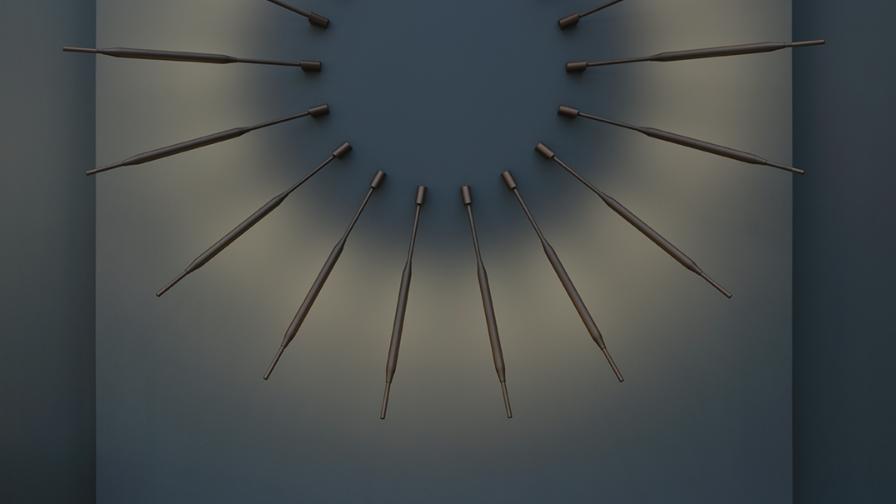 Contemporary metal sunburst style wall lighting on a dark blue backdrop