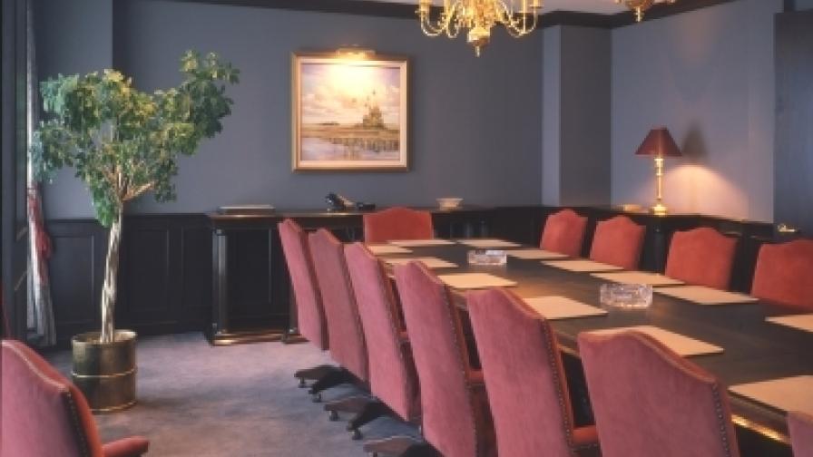 Rosewood table with suede covering on chairs