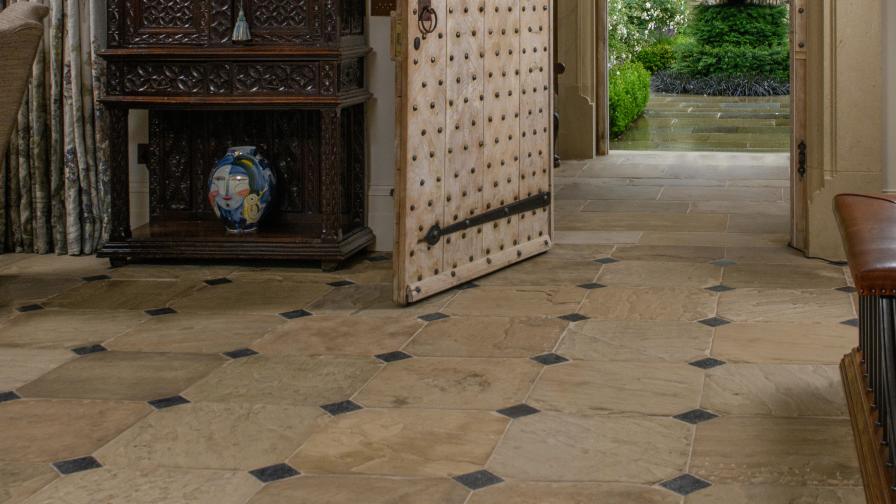 Reclaimed stone floor provided by specialists Lapicida in client hallway