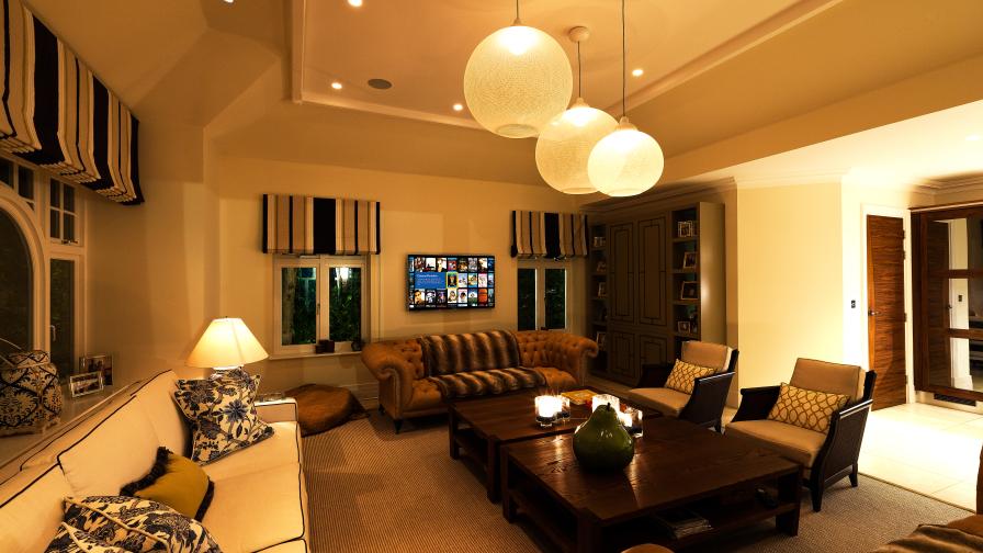 Media room with Lutron lighting and Kaleidescape movie server.