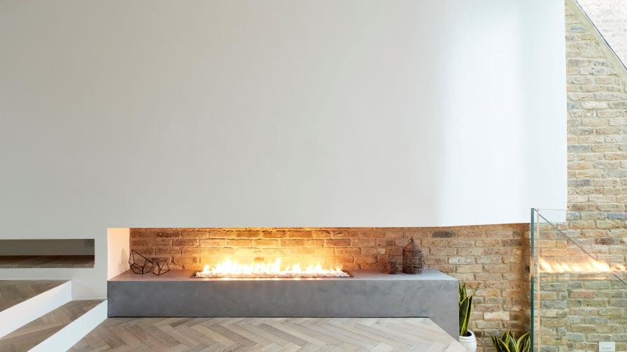 Modern open fire place and herringbone floor.