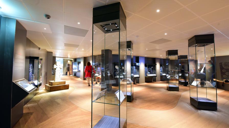 Select grade Oak flooring routed and oiled with various pigments to create meandering river in Viking Museum, York